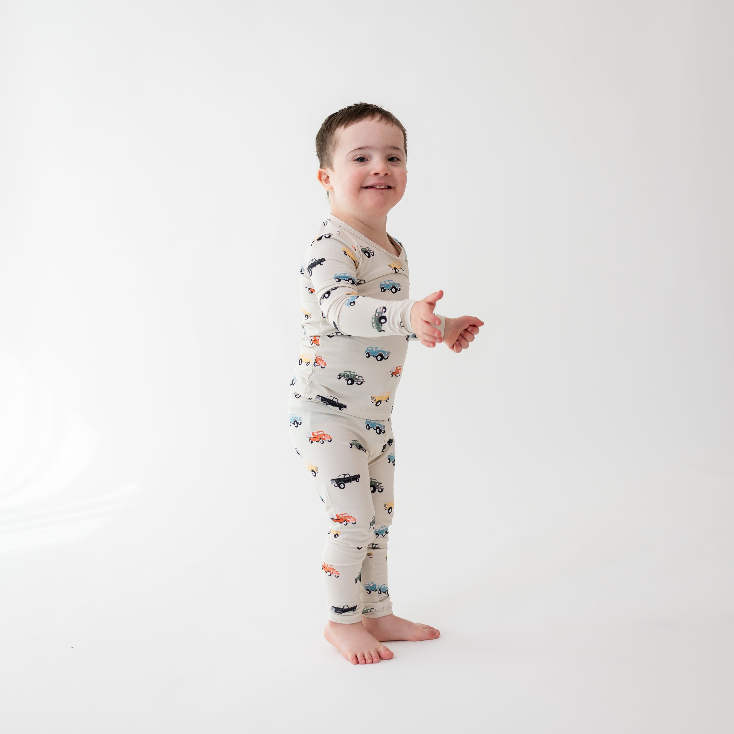 Toddler wearing Long Sleeve Bamboo Pajamas in Vintage Truck print
