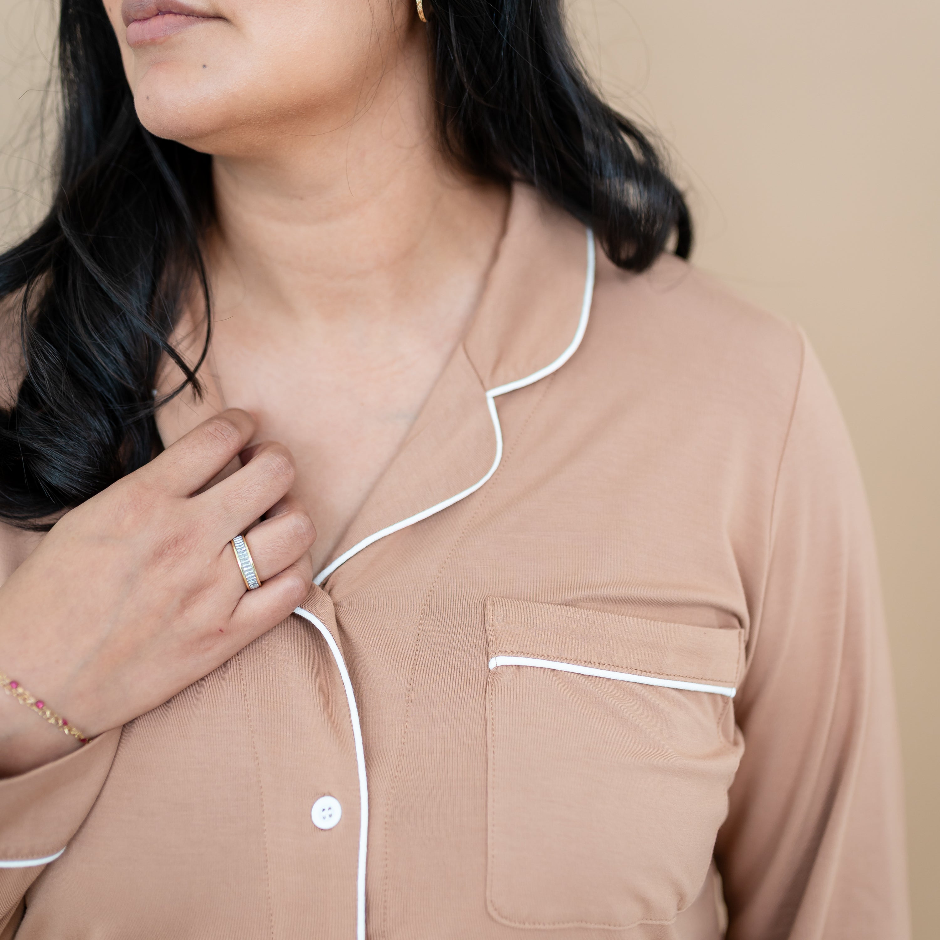 Close up of the Cloud trim and chest pocket of the Long-Sleeved Women's Pajama Set in Latte with Cloud Trim
