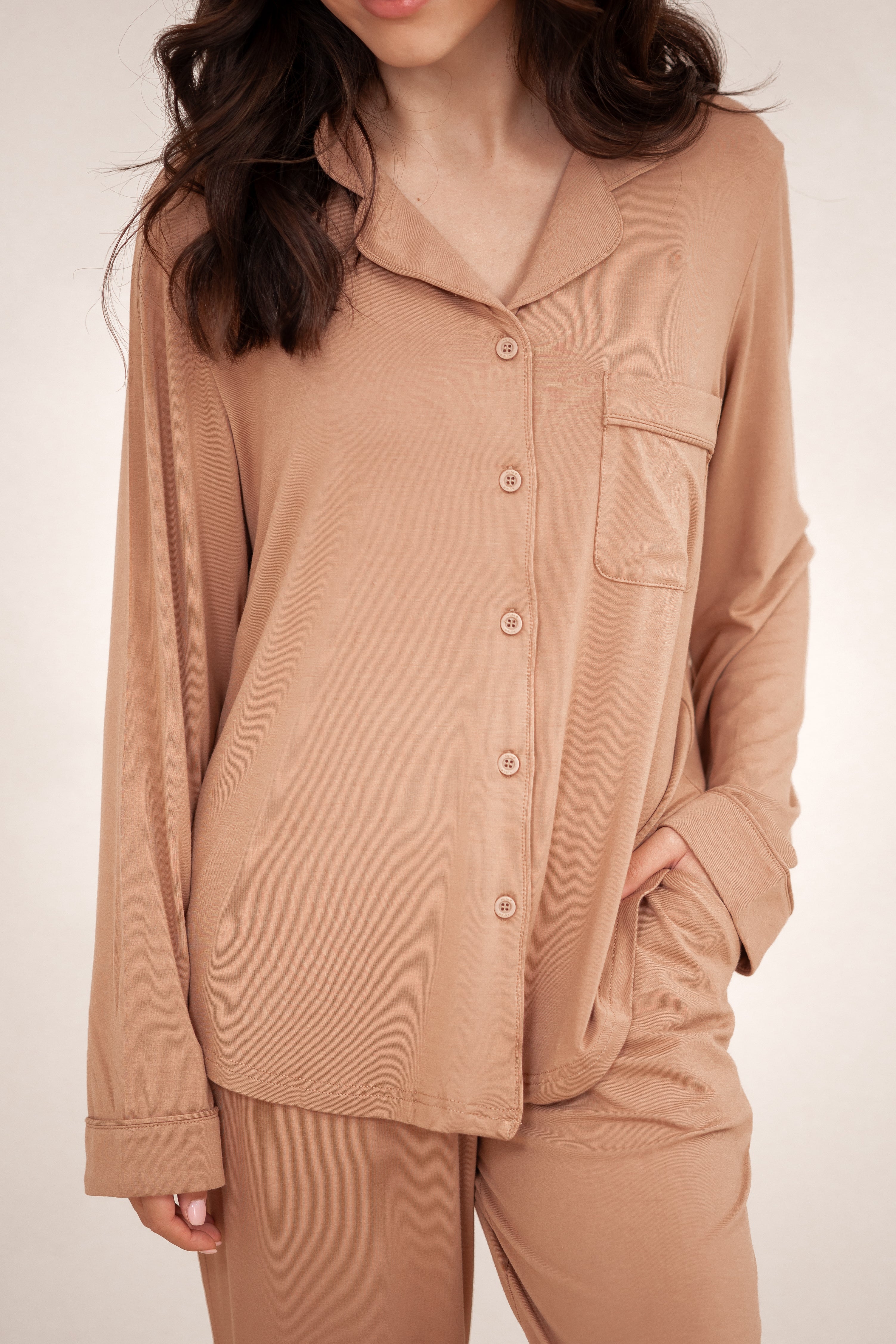 Close up of the button closures and chest pocket of the Long-Sleeved Women's Pajama Set in Latte with Latte Trim shown on a model