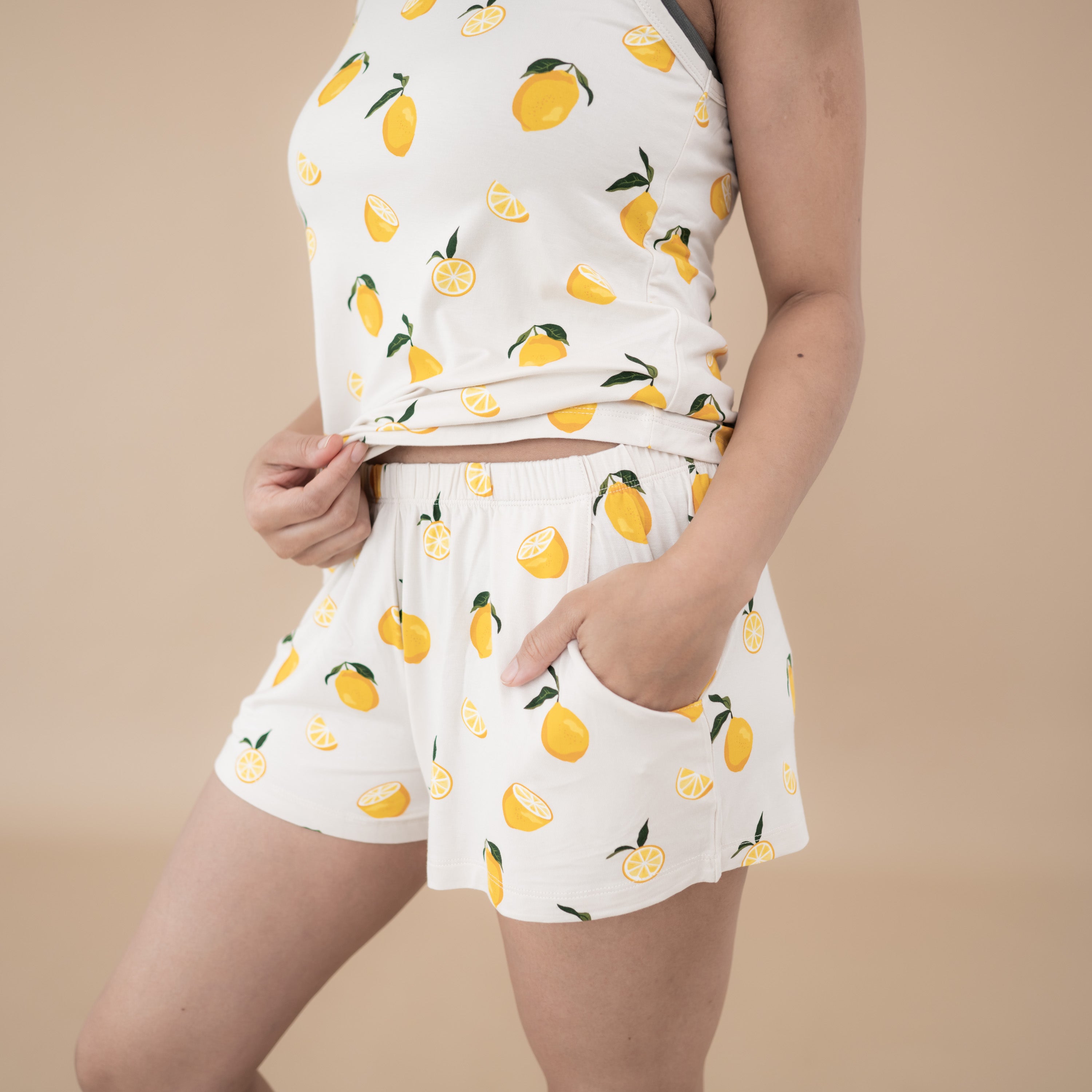Woman modeling Women’s Tank Set in Lemon showing waist band