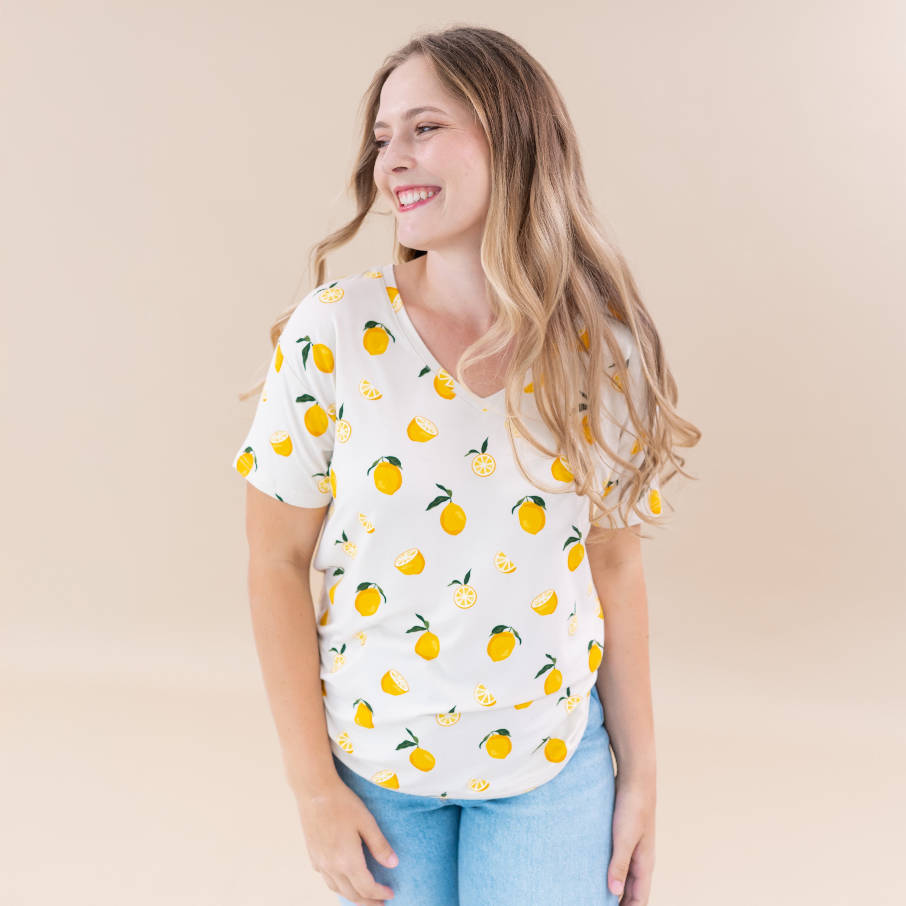 Woman wearing Kyte Baby Women's Relaxed Fit V-Neck tee in Lemon