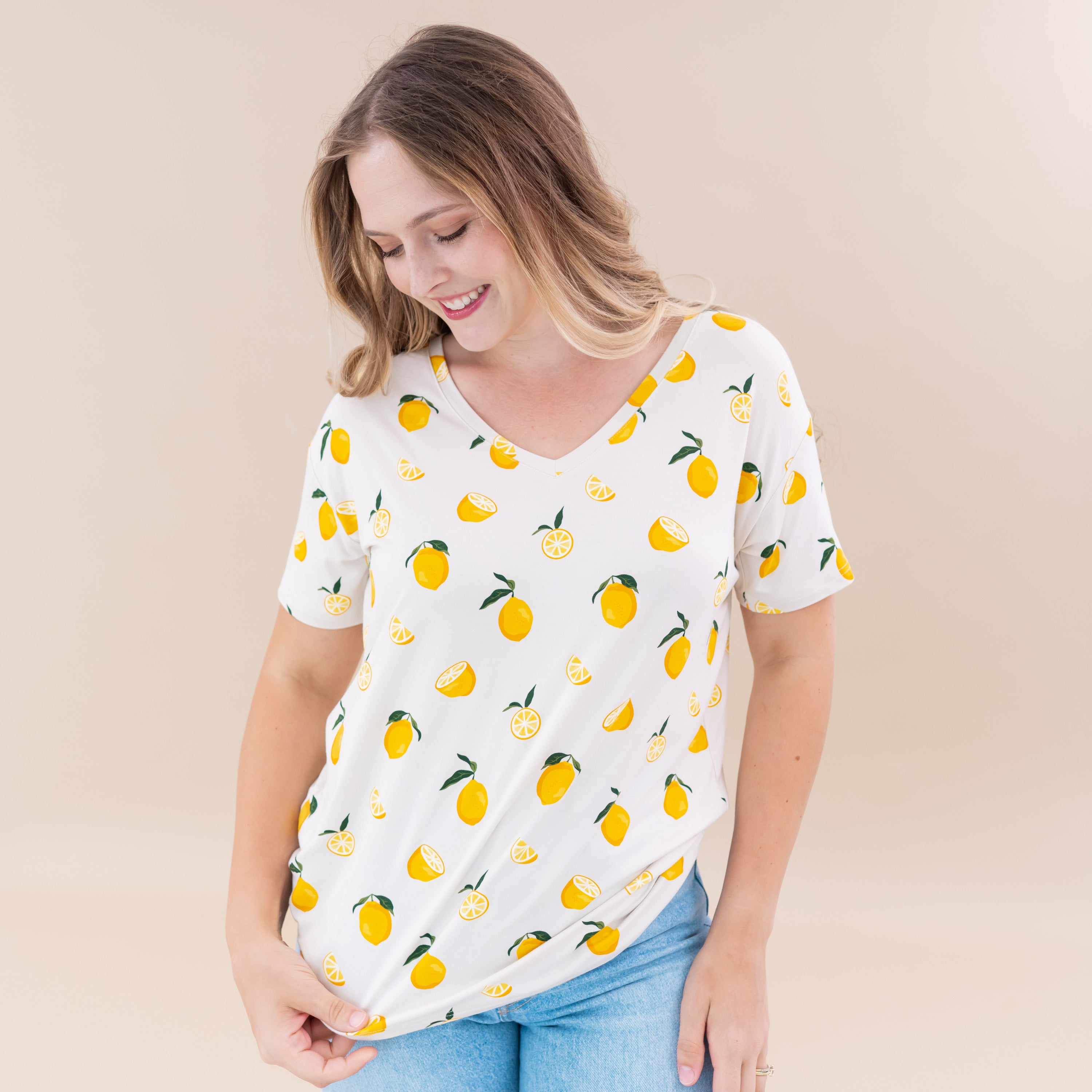 Woman wearing Kyte Baby Women's Relaxed Fit bamboo V-Neck tee in Lemon