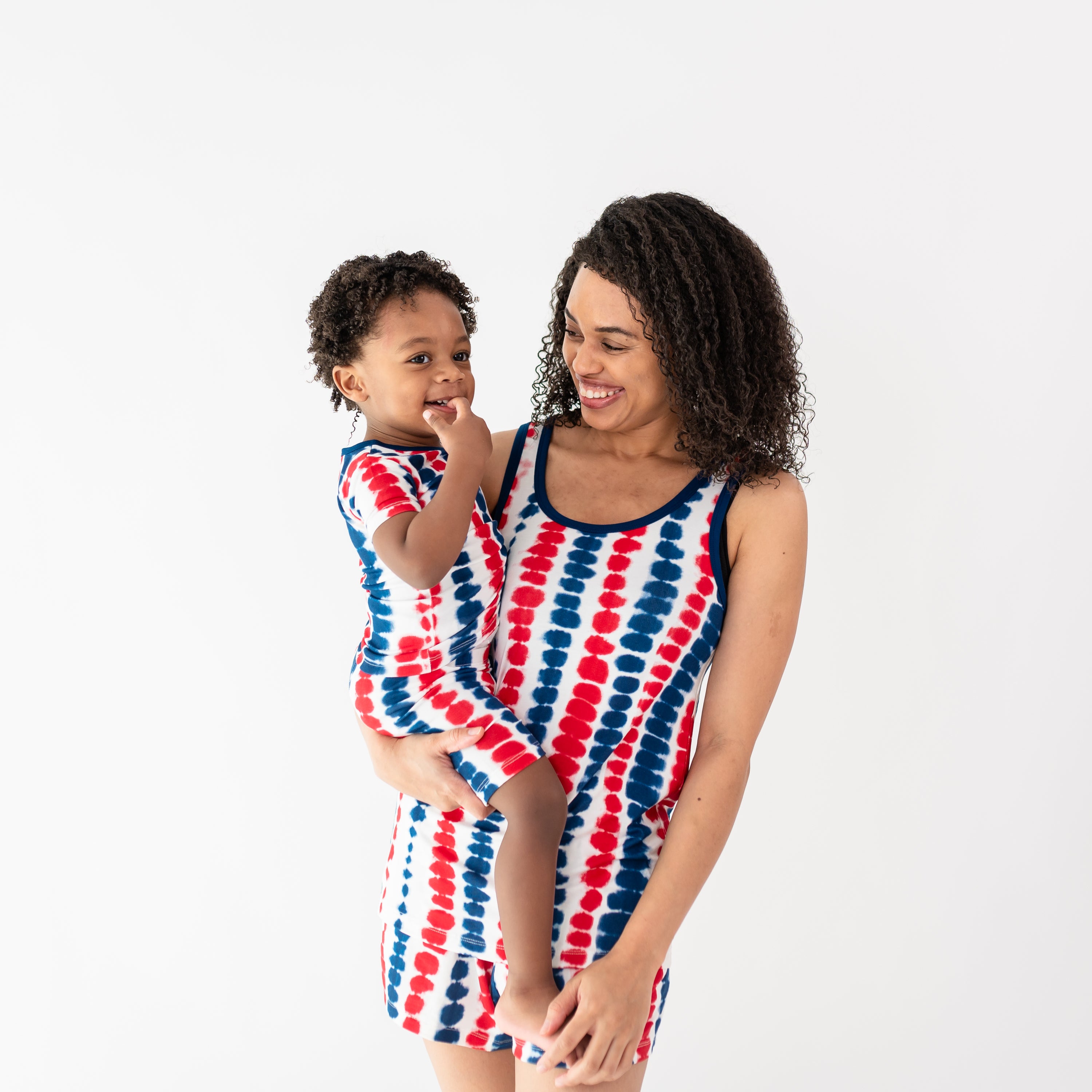 Woman modeling Women’s Tank Set in Liberty Rip Tide holding toddler in matching pajamas