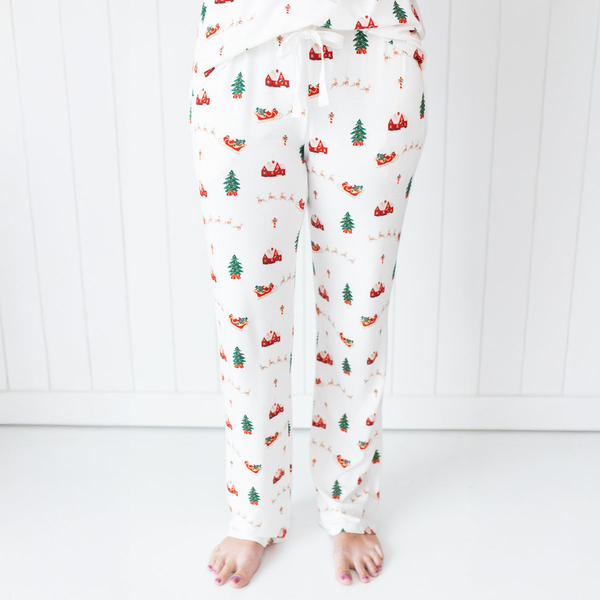Women's Lounge Pants in Santa Sleigh shown on a model