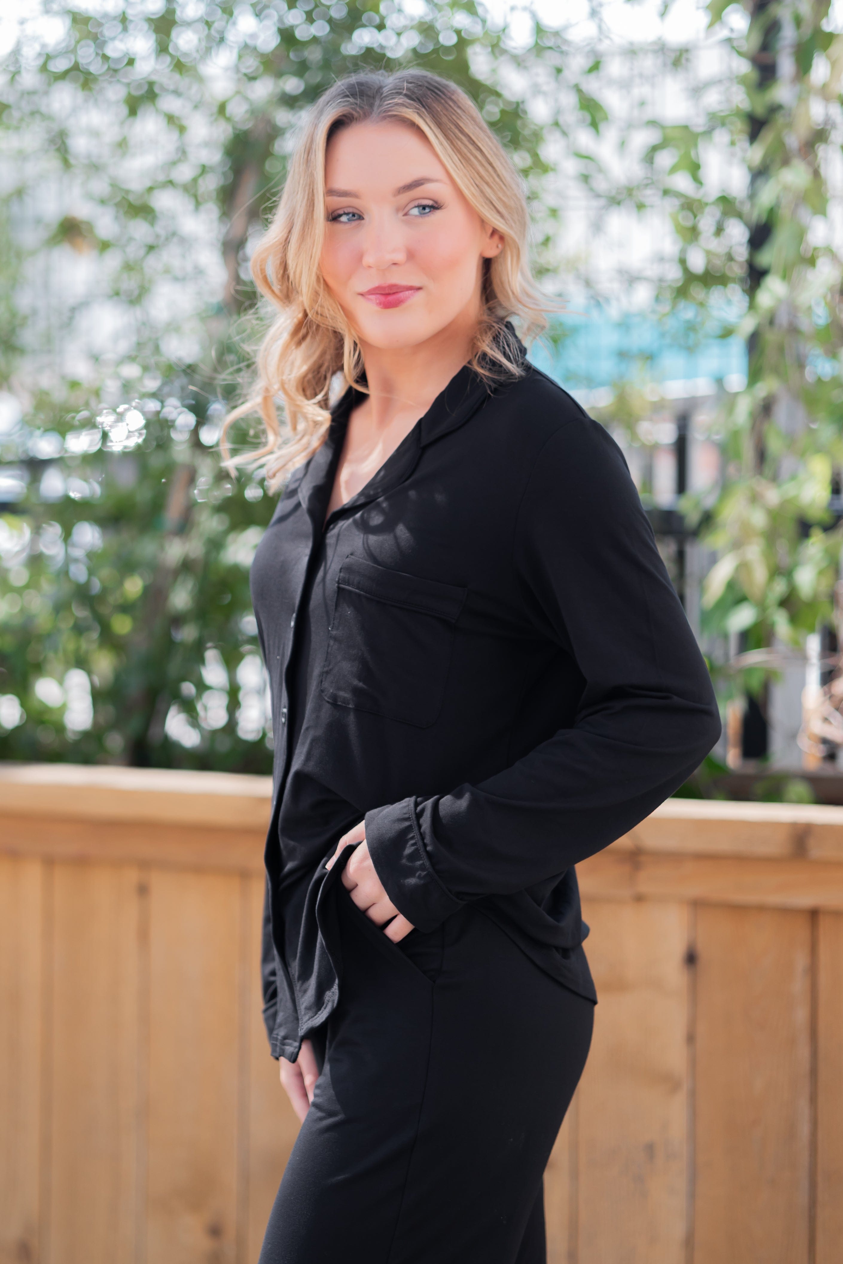 Female modeling the Long-Sleeved Women's Pajama Set in Midnight with Midnight Trim