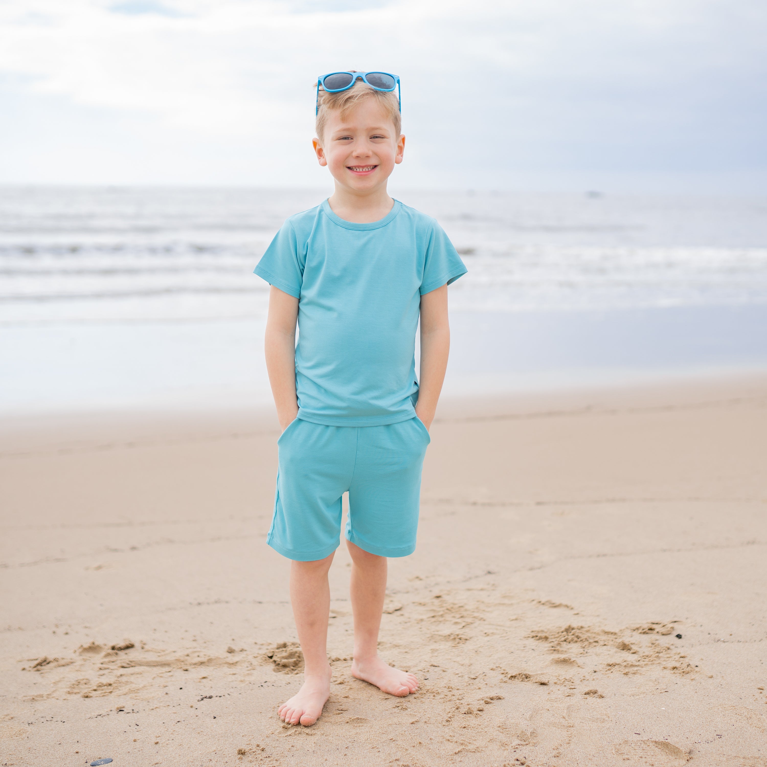 Toddler modeling Bamboo Drawstring Short and Basic Tee in Makai Blue