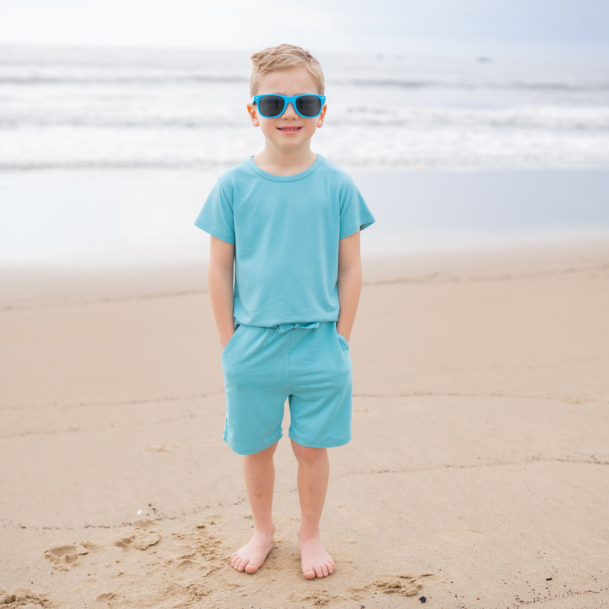 Toddler modeling Drawstring Short in Makai and matching Basic Tee