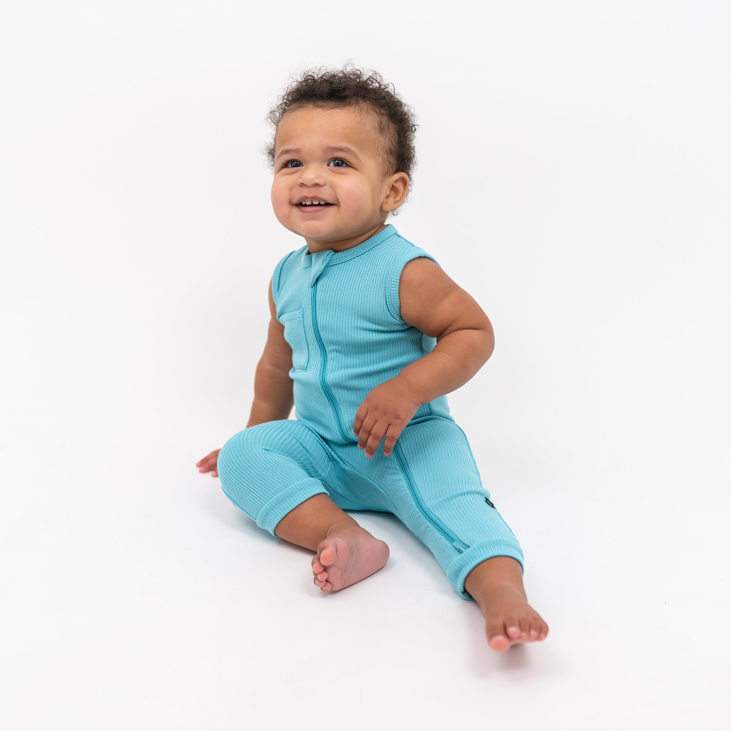 Child wearing Bamboo Ribbed Zippered Blue Sleeveless Romper in Makai