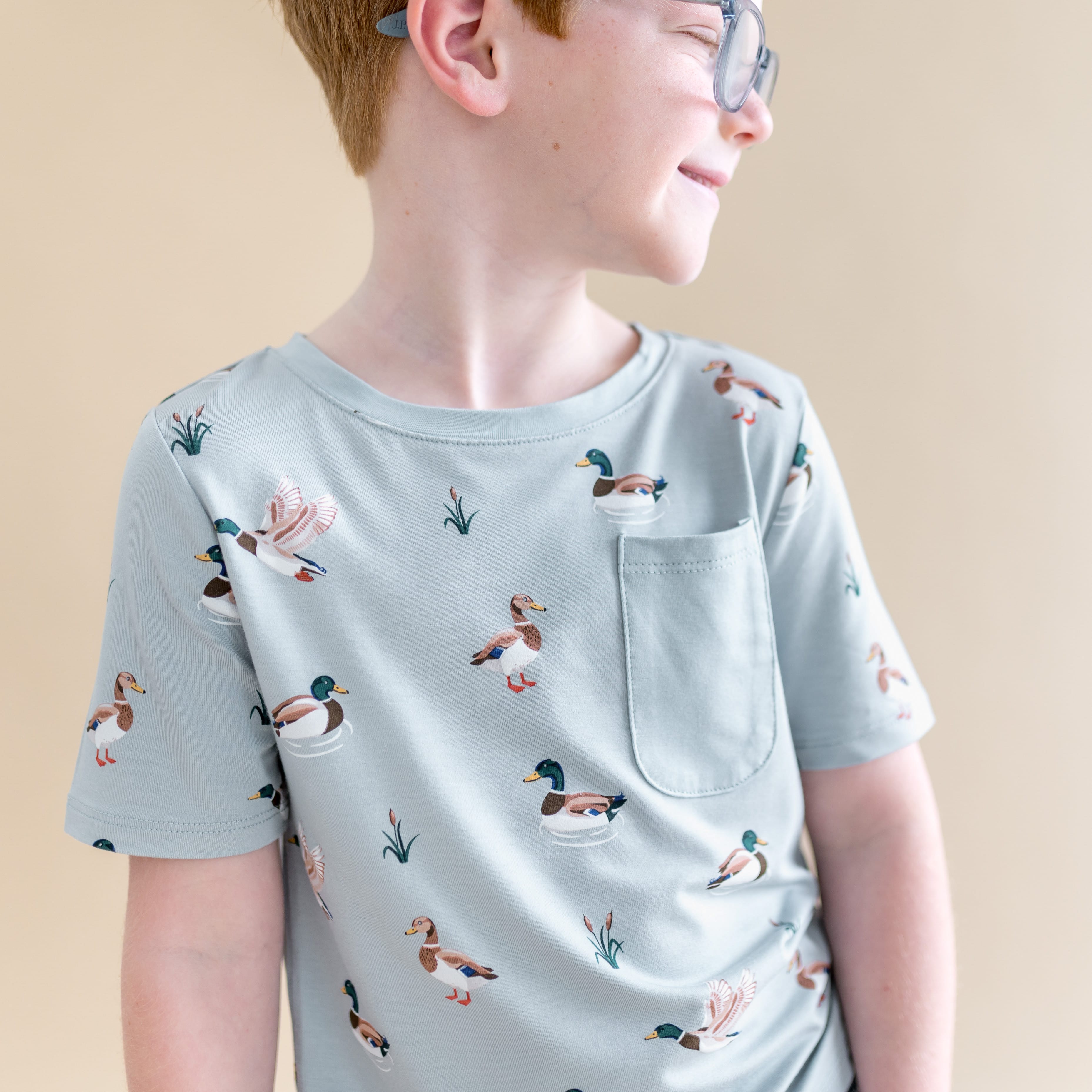 Close up of young boy wearing the Toddler Crew Neck Tee in Mallard Duck