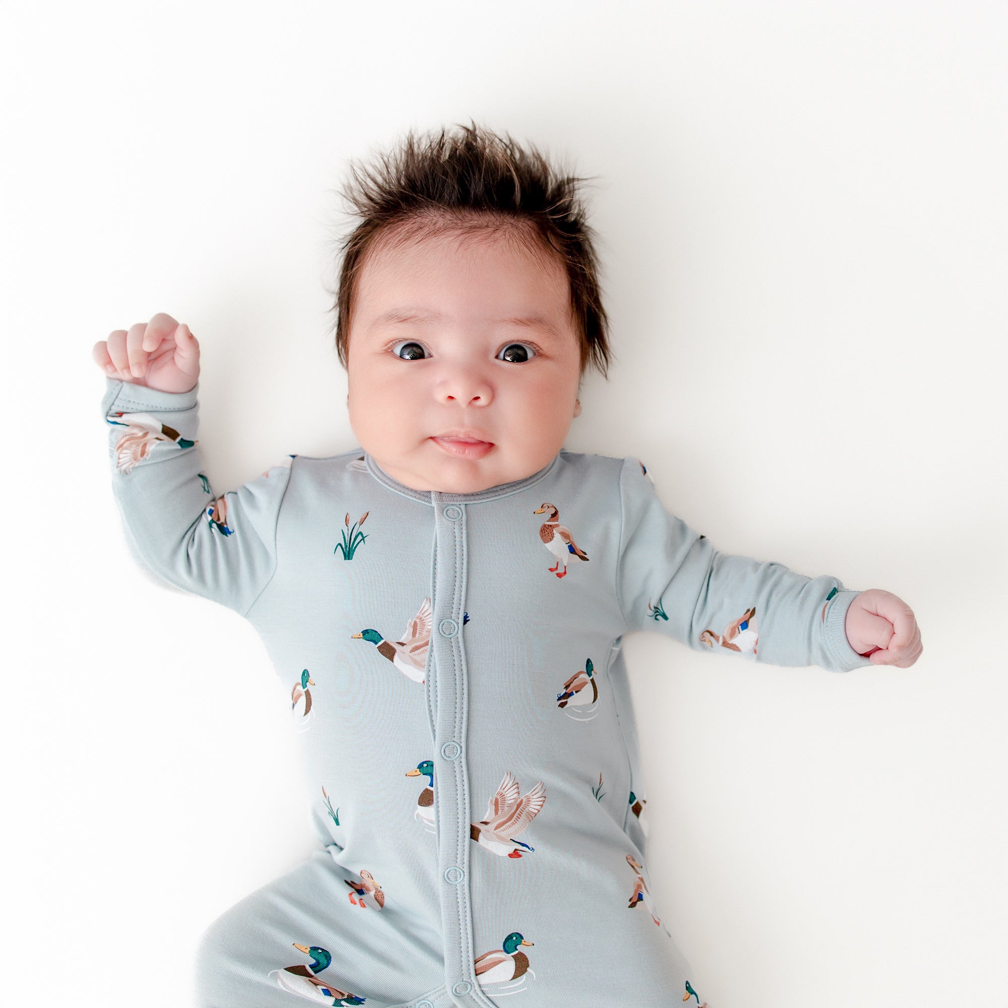 Close up of newborn wearing the Romper in Mallard Duck