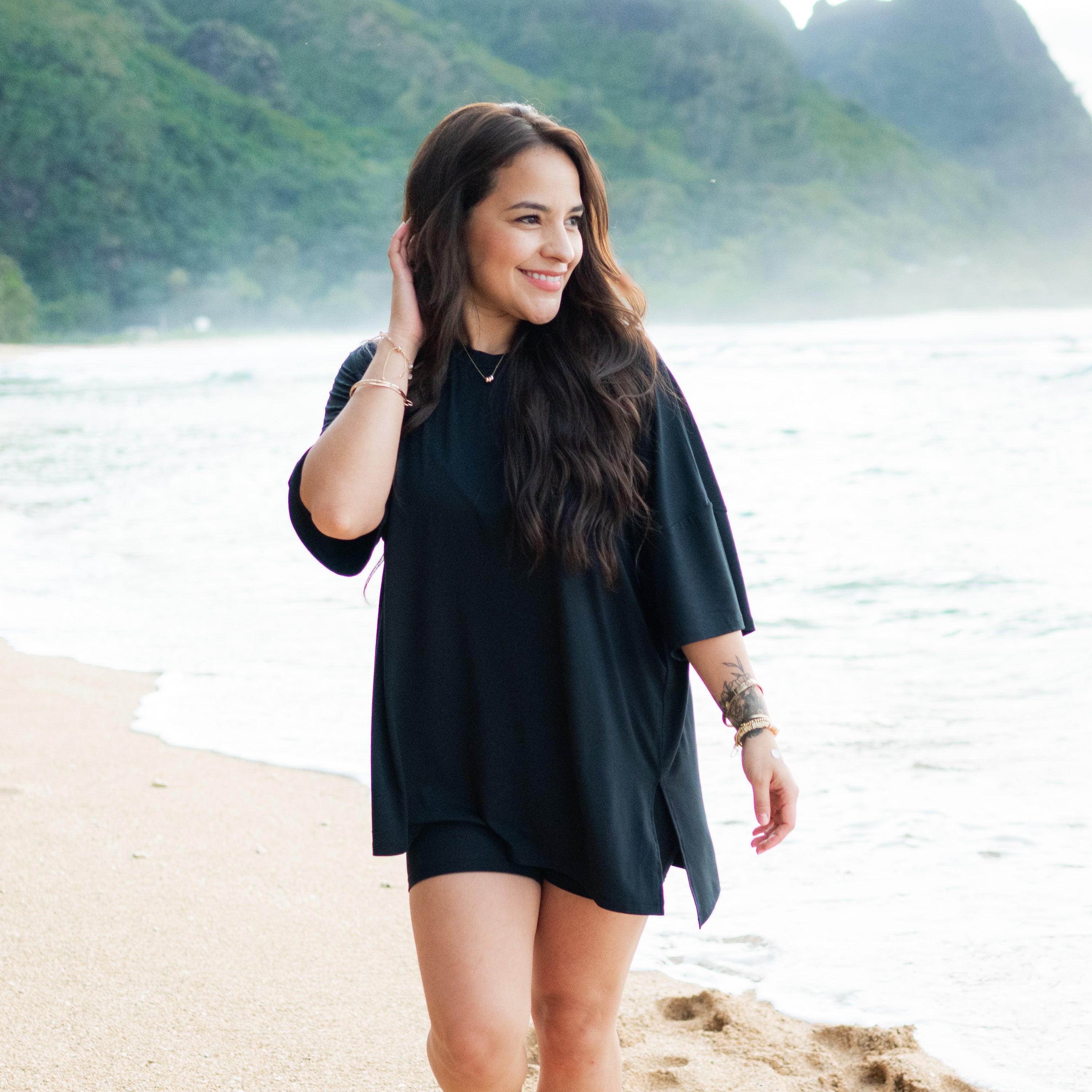 Woman modeling Women’s Biker Short Set in Midnight on beach