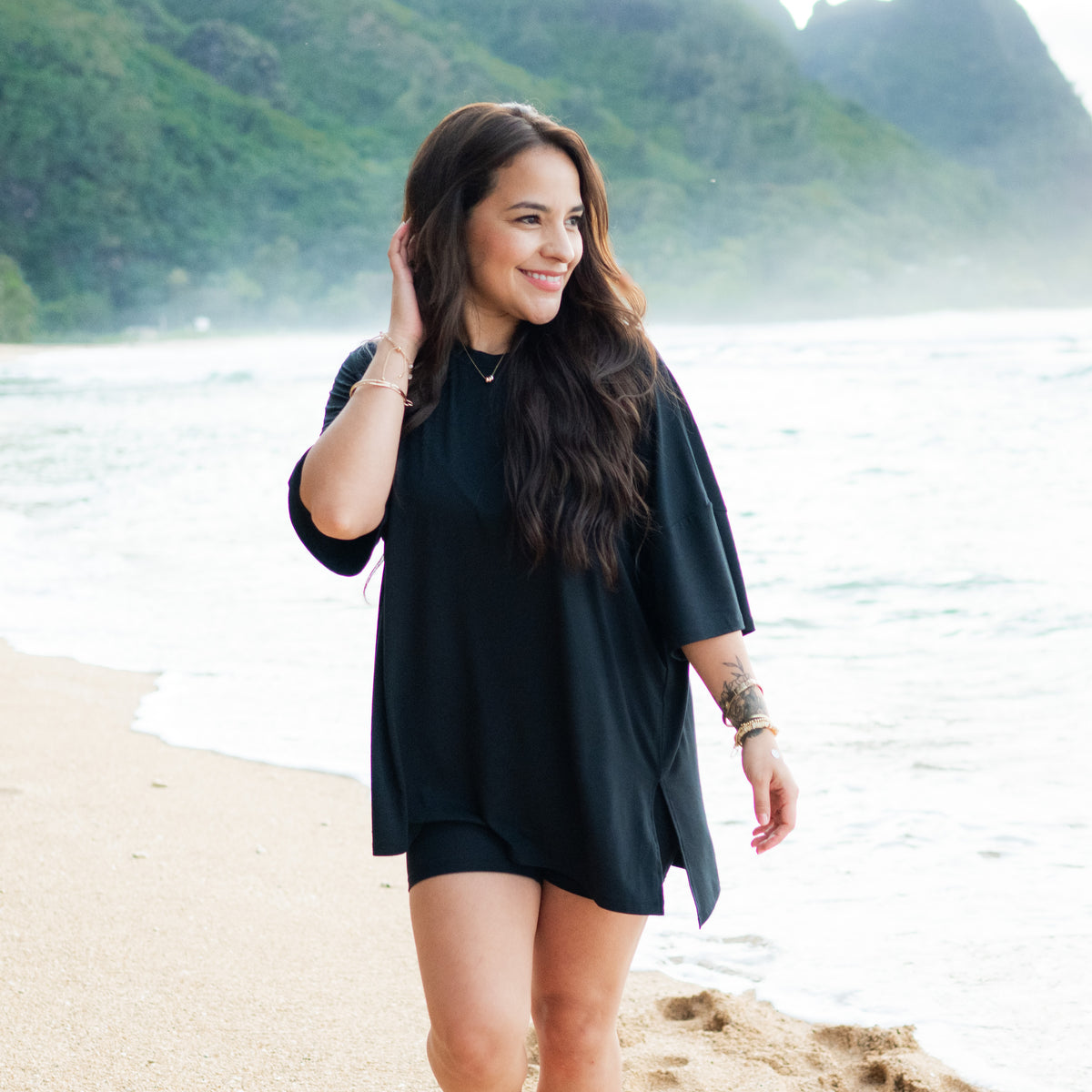 Woman modeling Women’s Biker Short Set in Midnight on beach