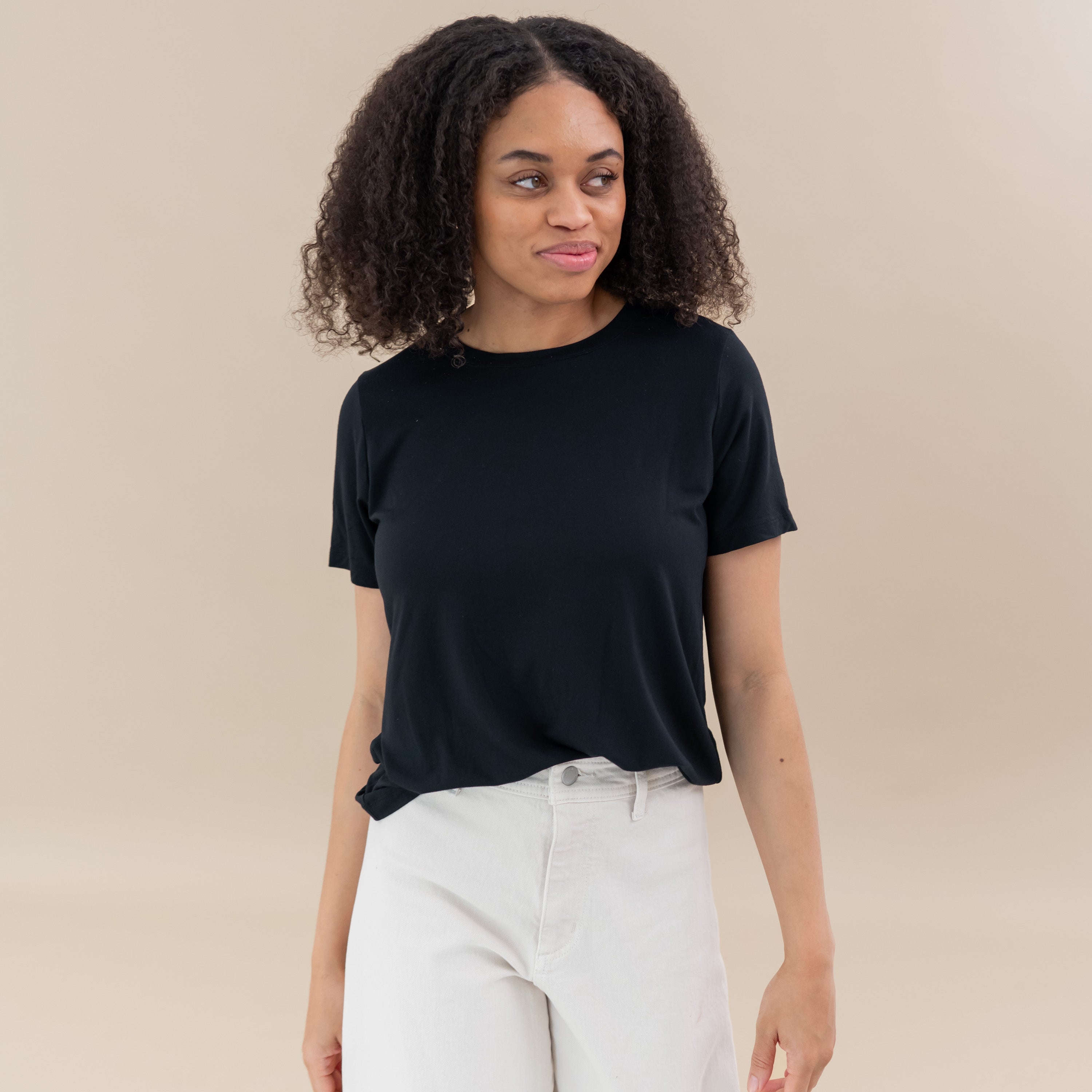 Woman modeling Women's Crew Neck Tee in Midnight