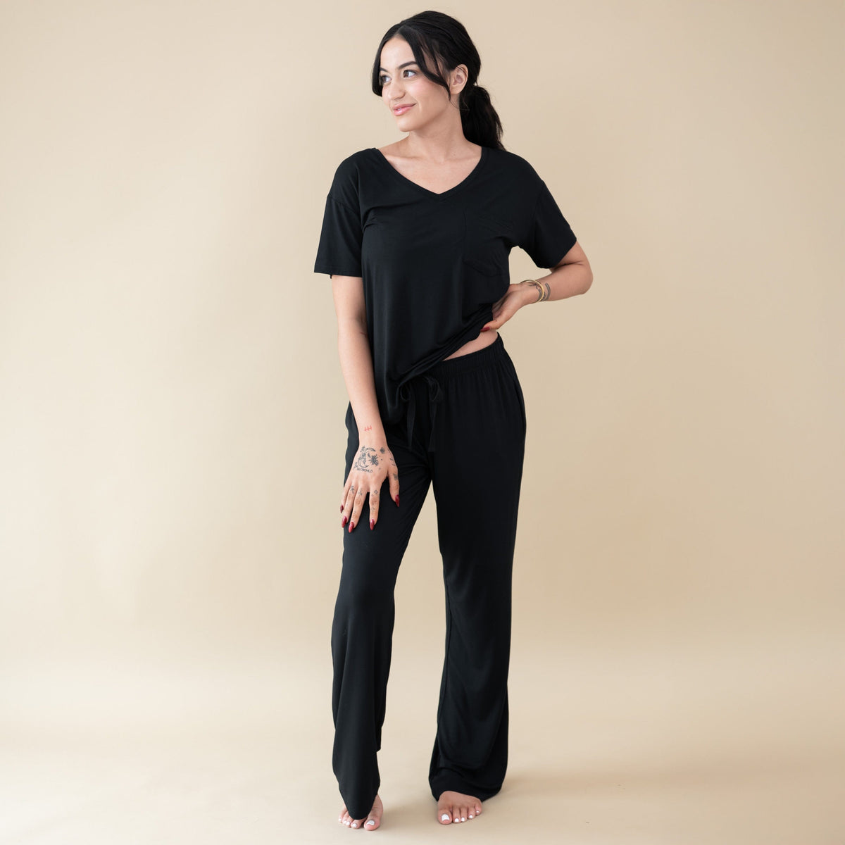 Woman modeling Women's Lounge Pants in Midnight and v-neck