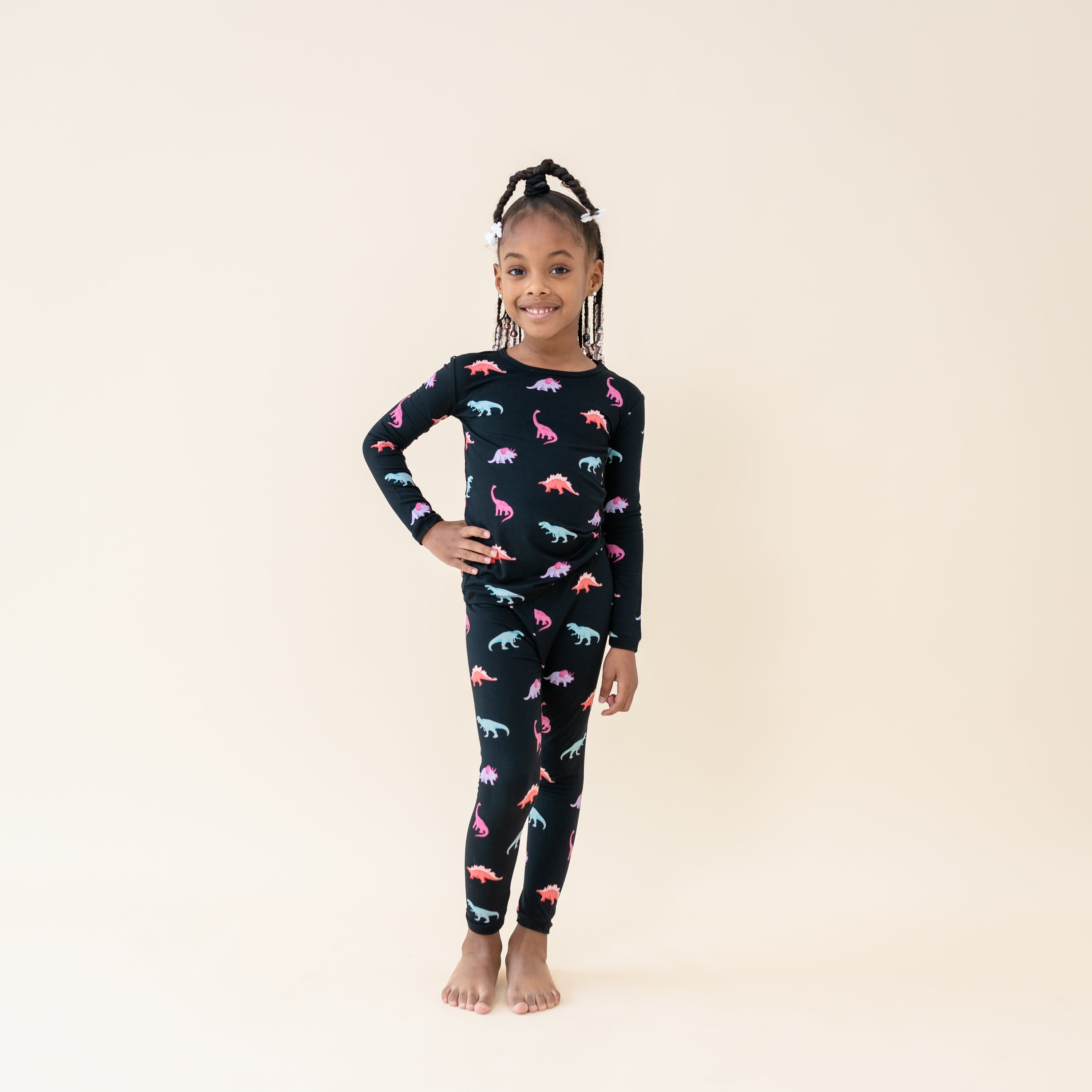 Young girl modeling the Long Sleeve Toddler Pajama Set in Midnight Roar