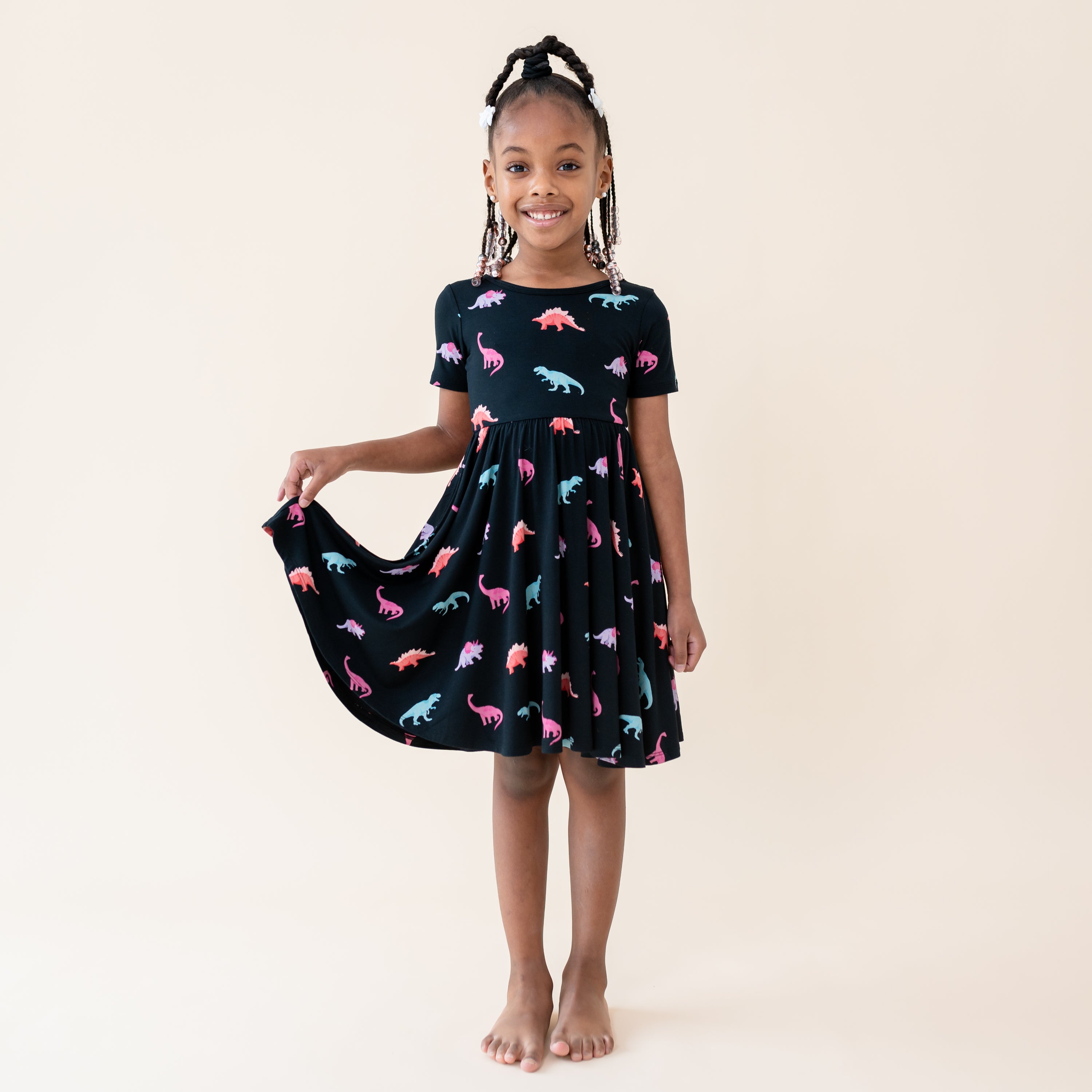 Young girl modeling the Midnight Roar Short Sleeve Twirl Dress