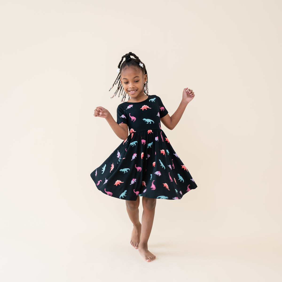 Girl twirling in the Midnight Roar Twirl Dress
