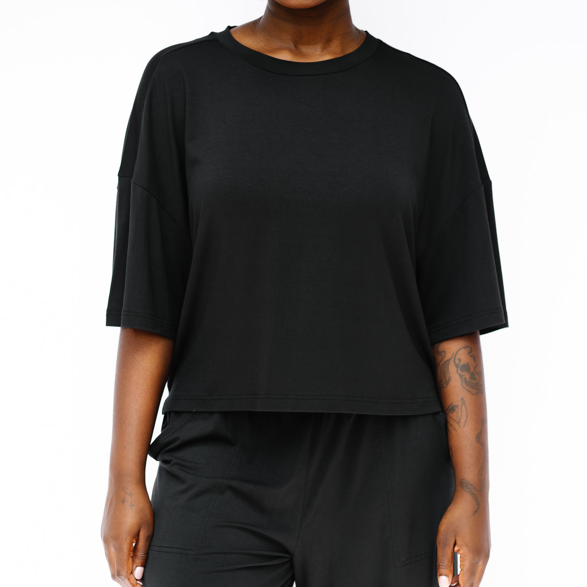 Women's Short Sleeve Tee in Midnight shown on a model