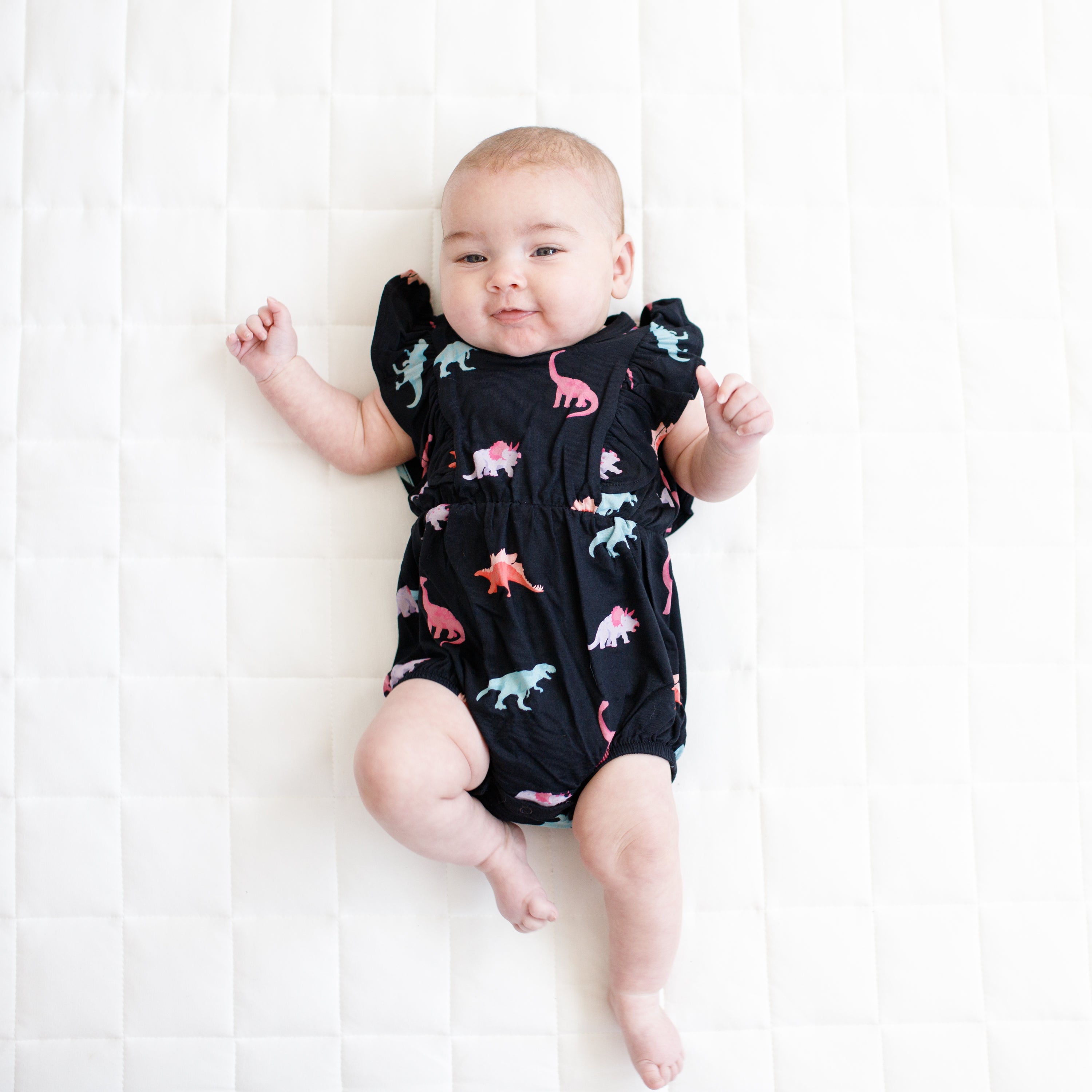 Baby wearing Flutter Sleeve Bubble Romper in Midnight Roar