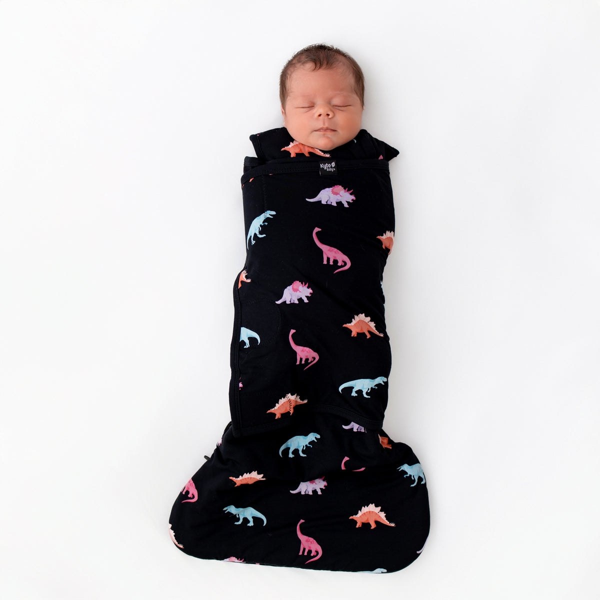 Baby sleeping in Midnight Roar Sleep Bag Swaddler