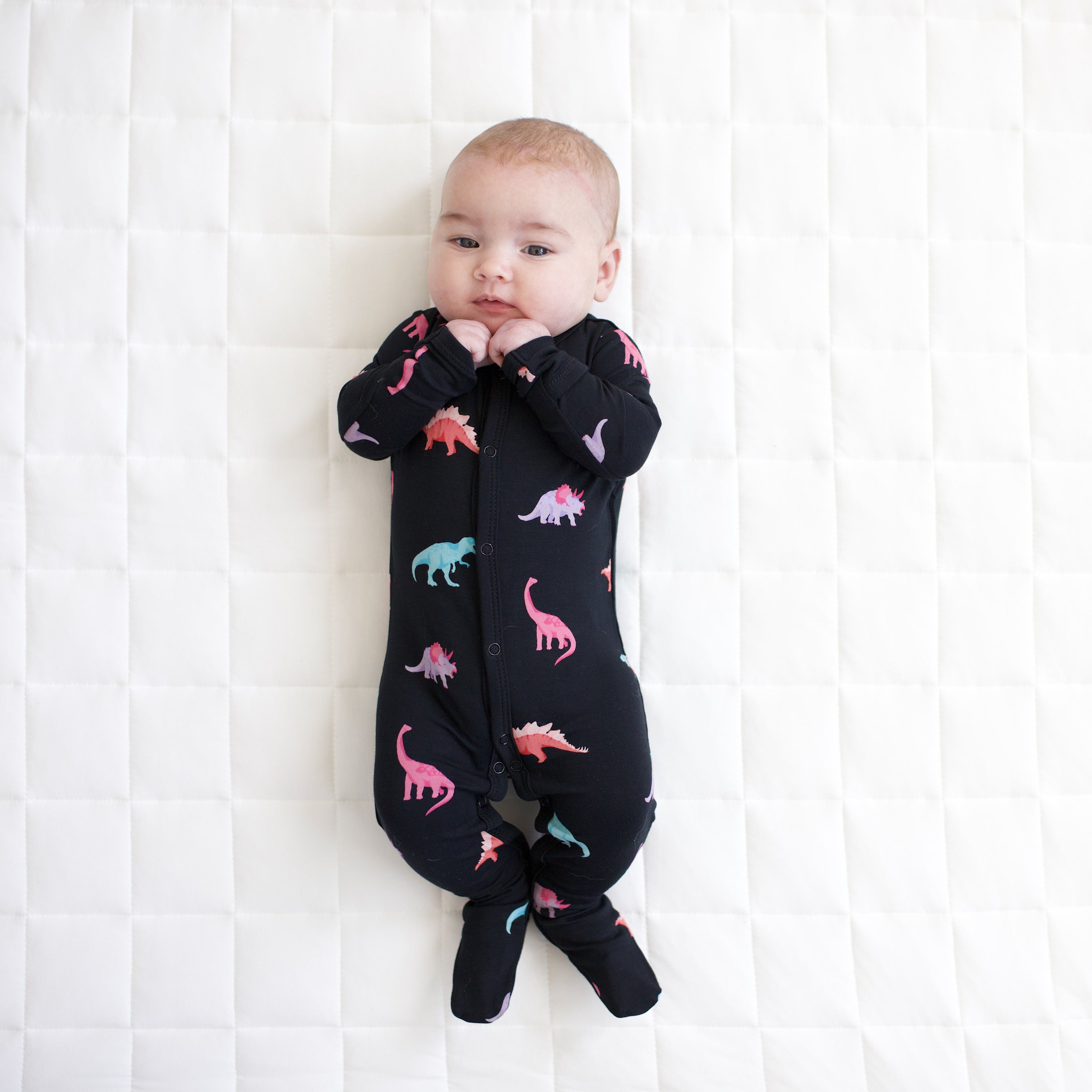Baby modeling snap footie in midnight roar