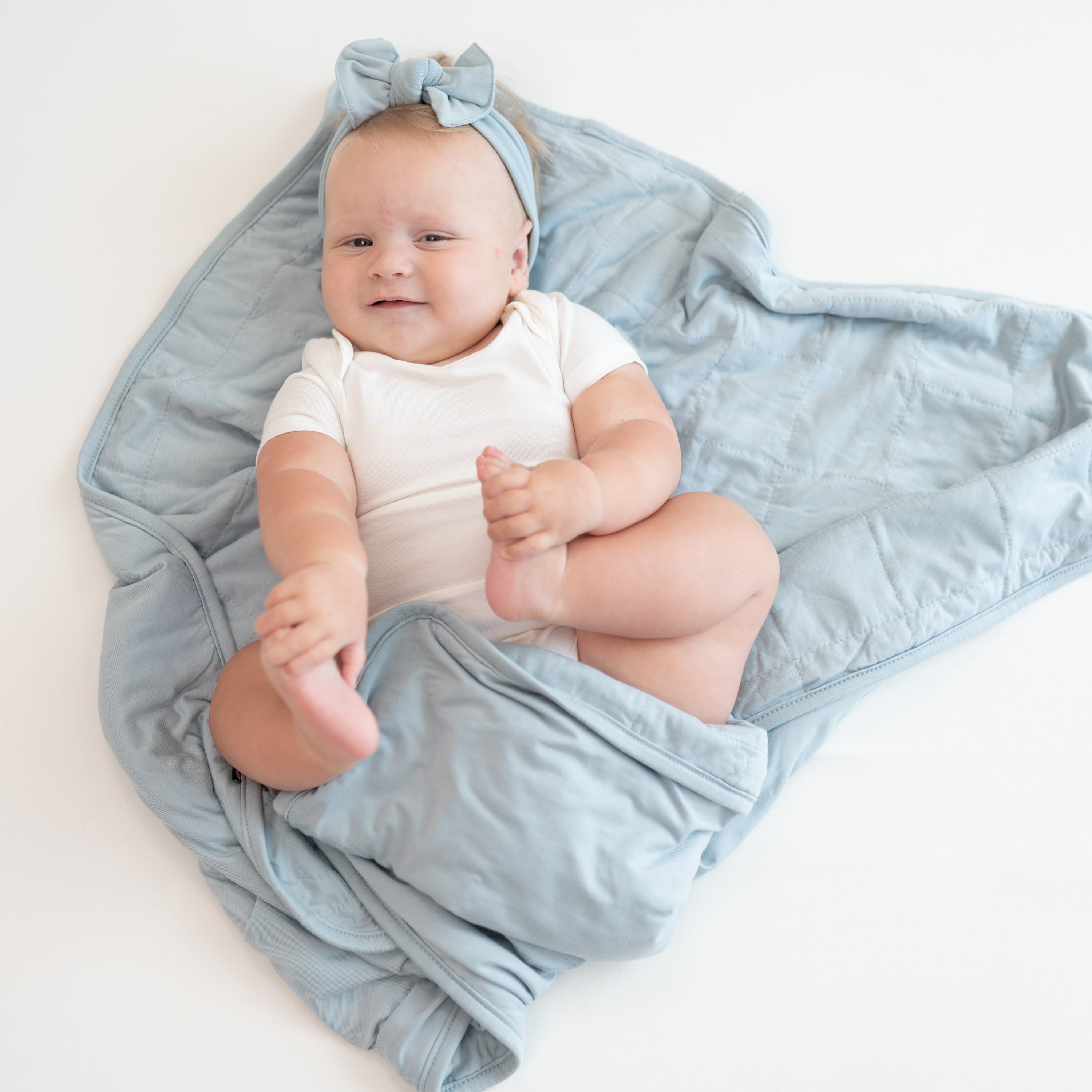 Baby in Cloud bodysuit laying on Baby Blanket in Fog 1.0