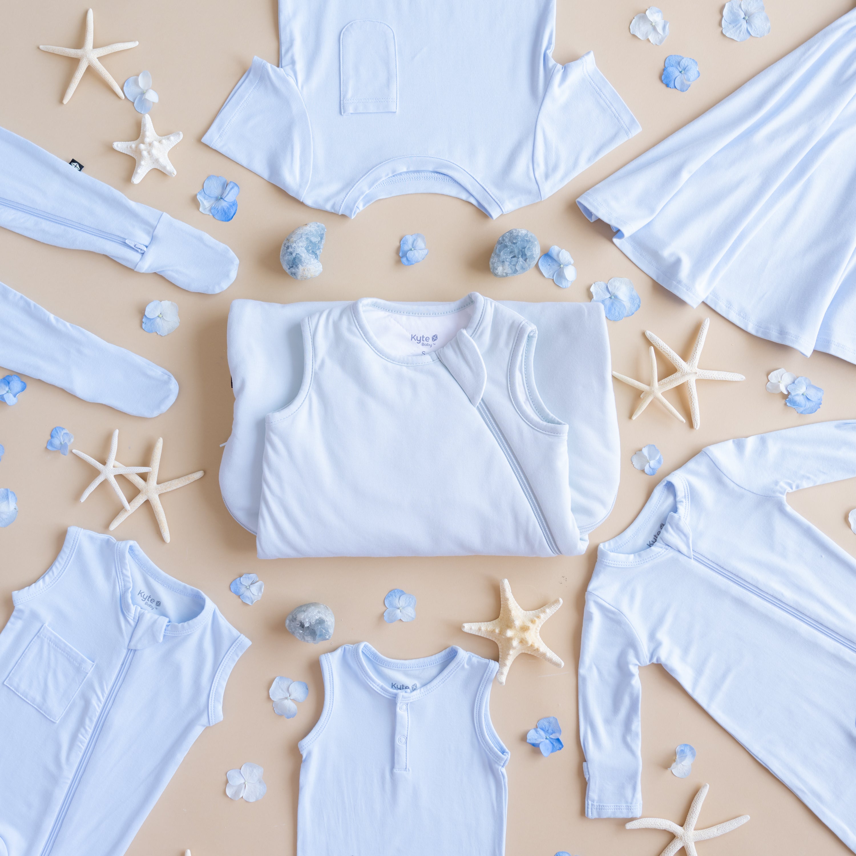 Flat lay of Mist collection with sea glass and star fish