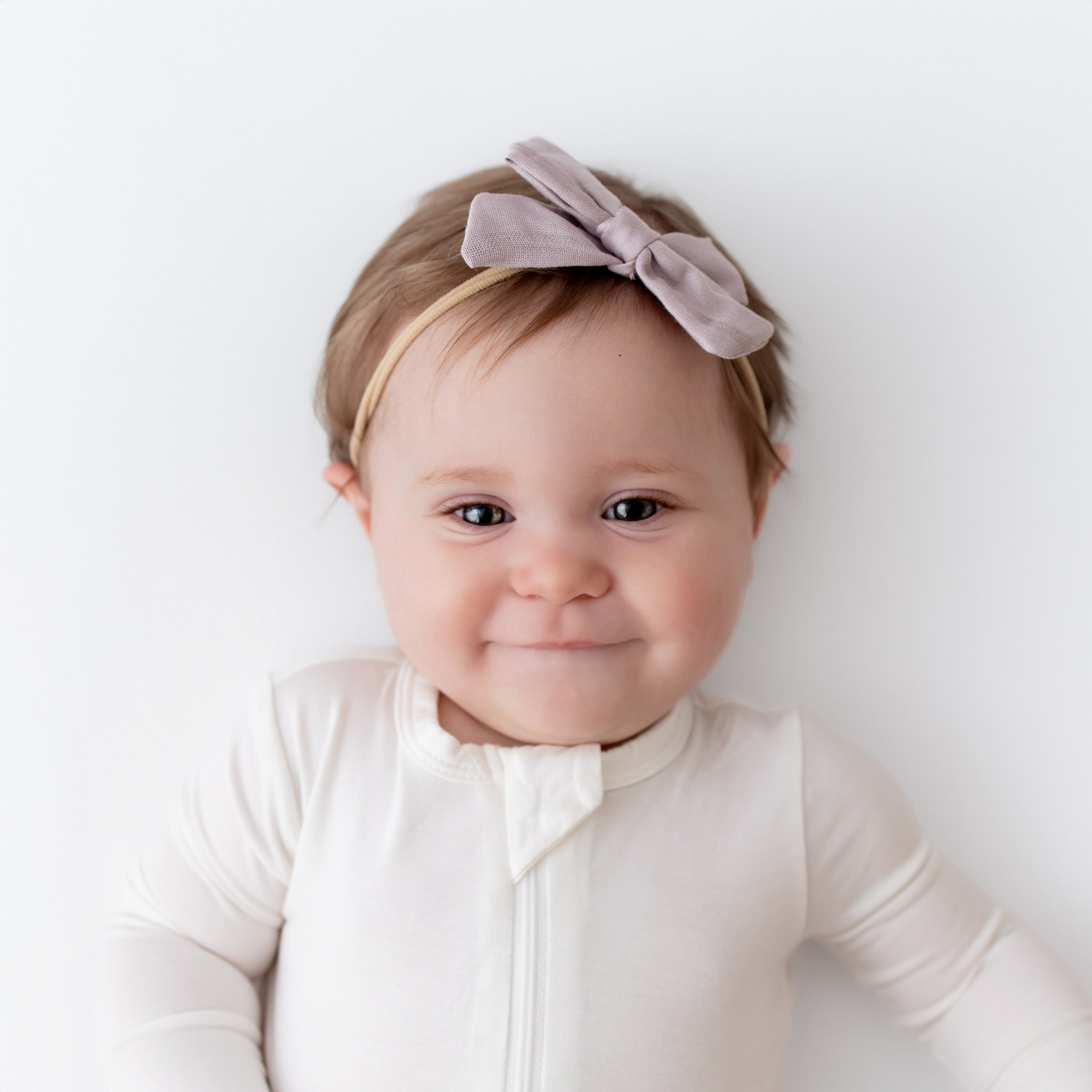 Baby wearing Bamboo Muslin Medium Bow in Wisteria