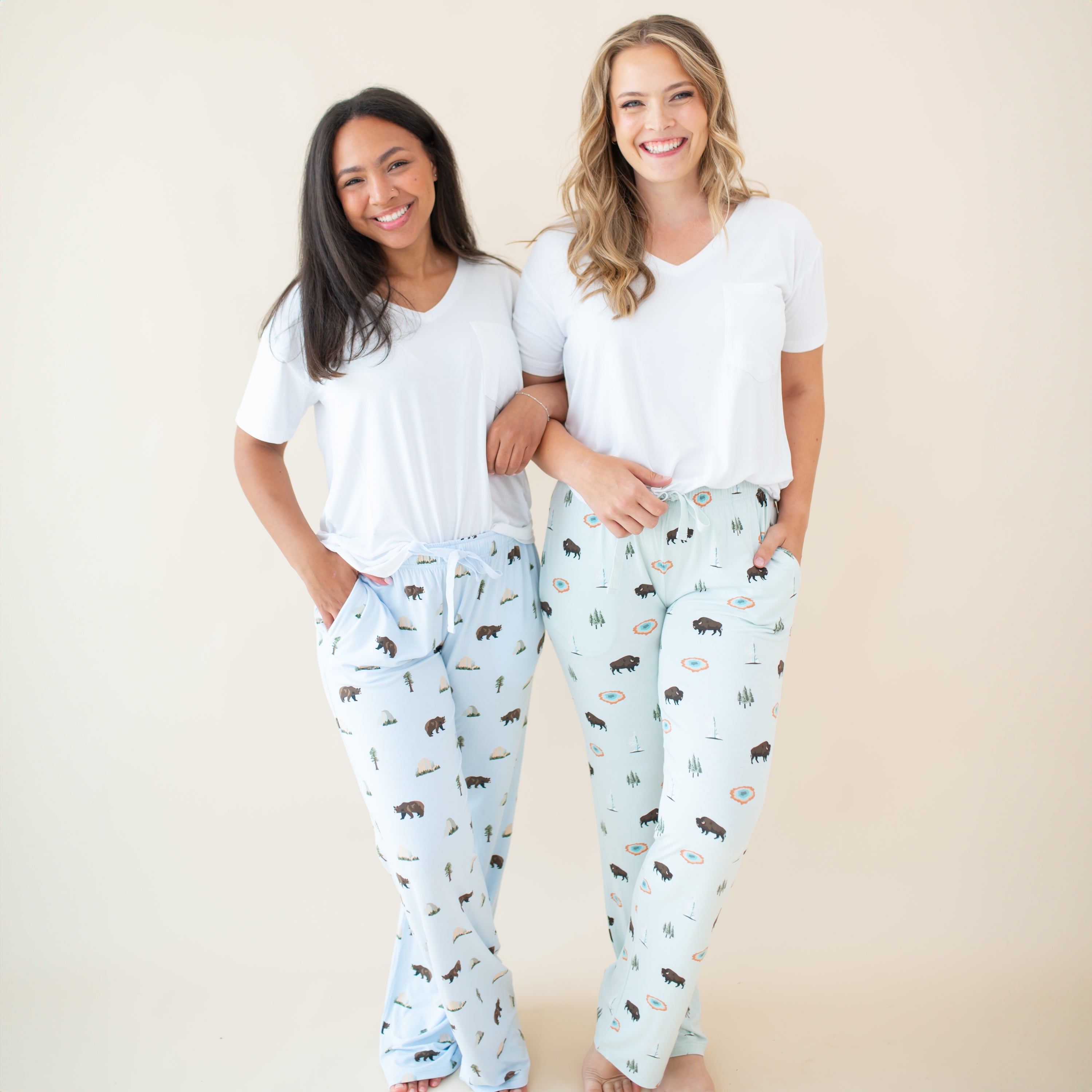 2 women modeling Women's Lounge Pants in Yellowstone and Yosemite with Snow V-neck tees
