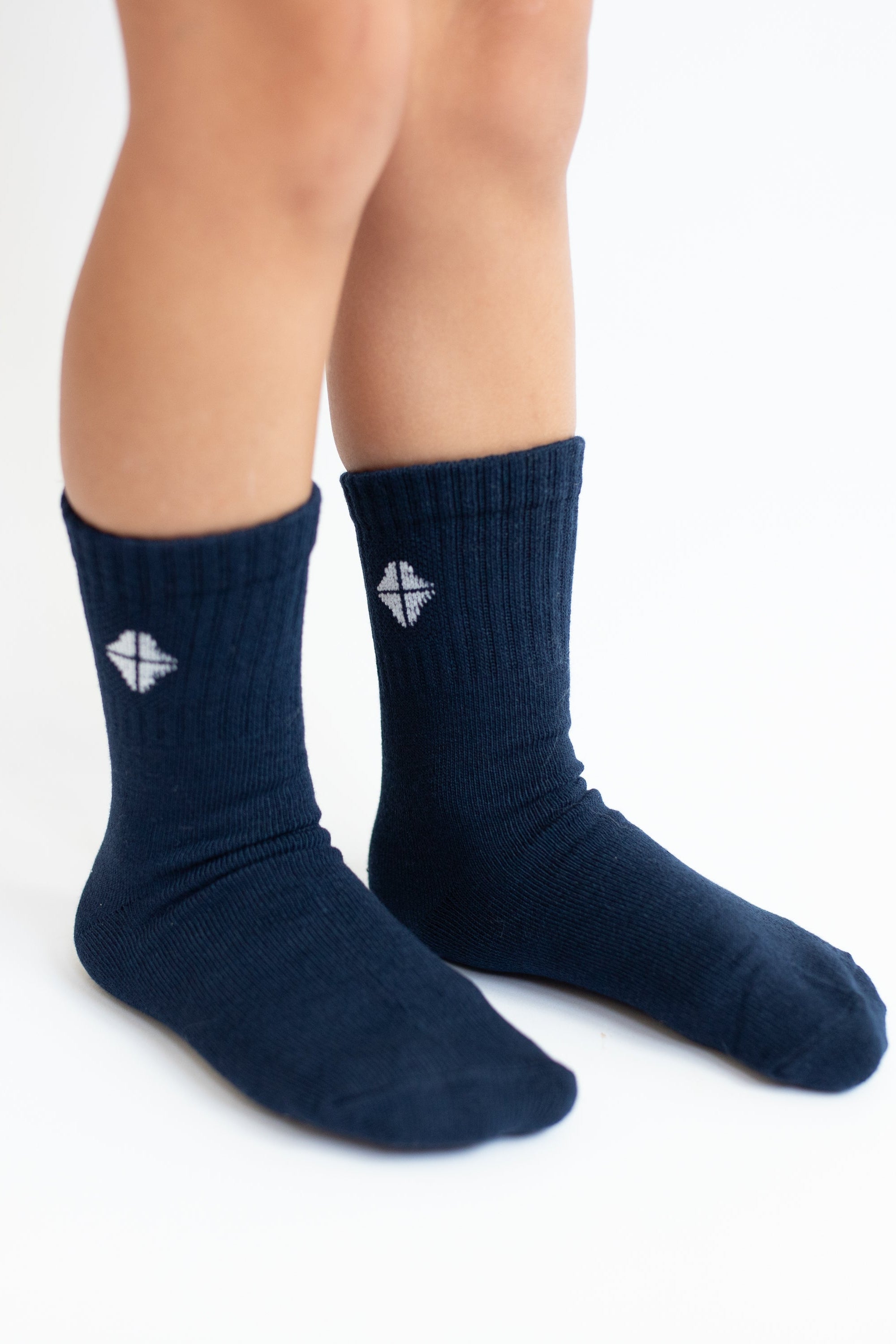 Crew Socks in Navy shown on a toddler model