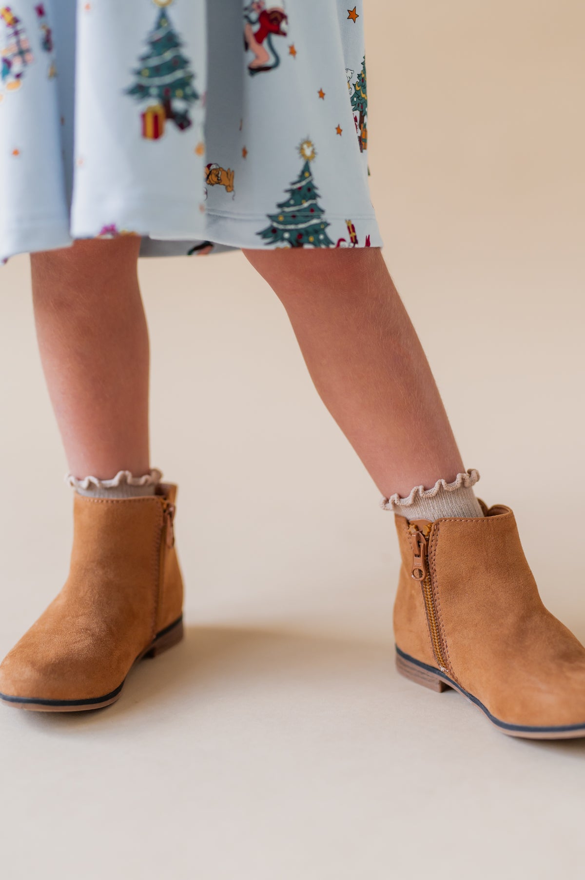 Modal is wearing Ruffle Socks in Neutral color on boots