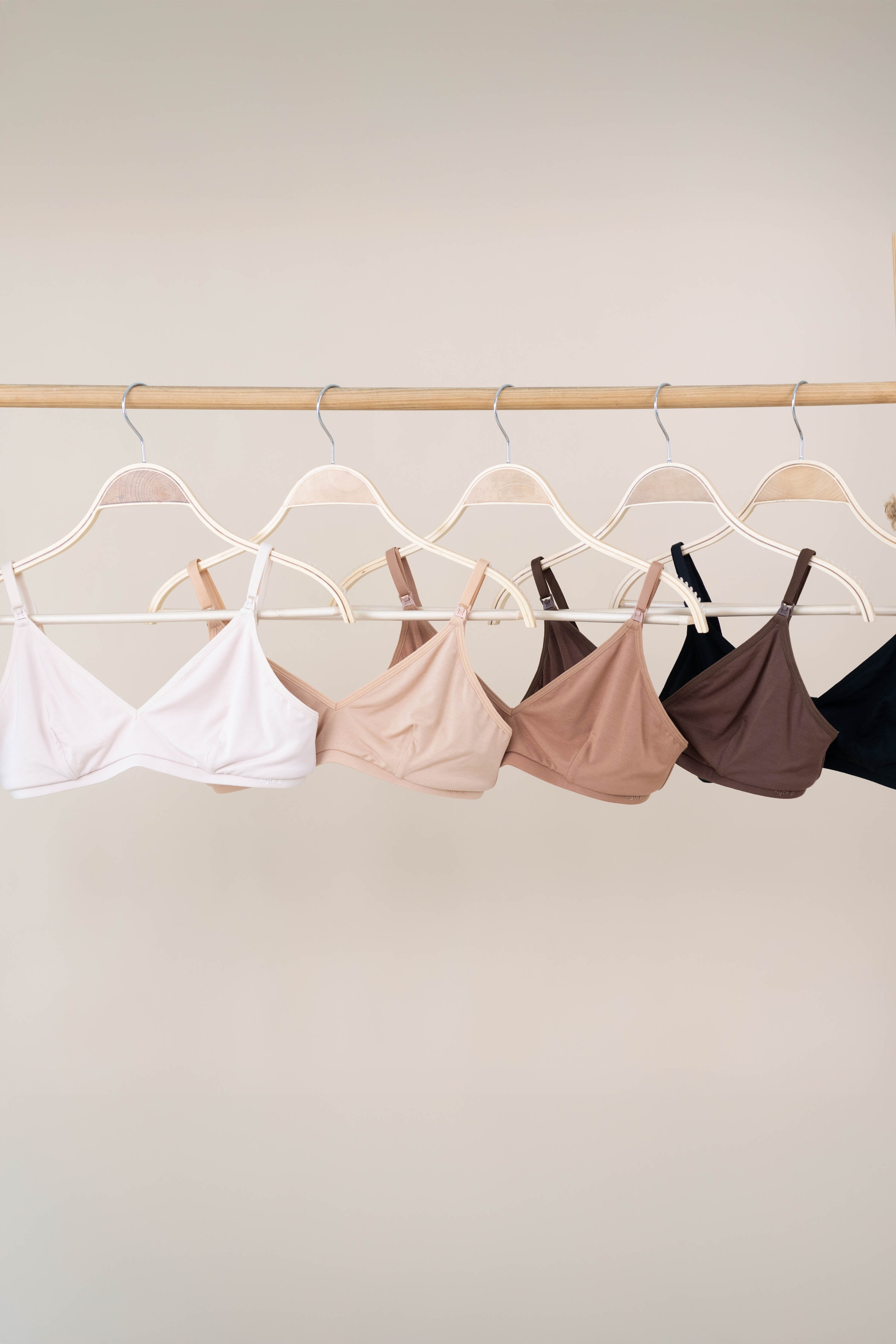 Women's Nursing Bra in Neutrals hanging on a hanger