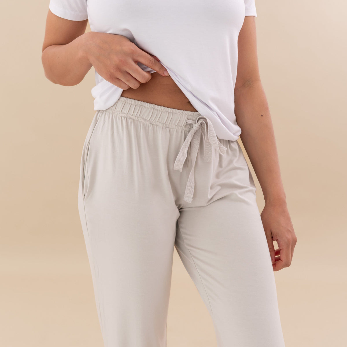 Woman modeling Women’s Lounge pant in oat showing waist band