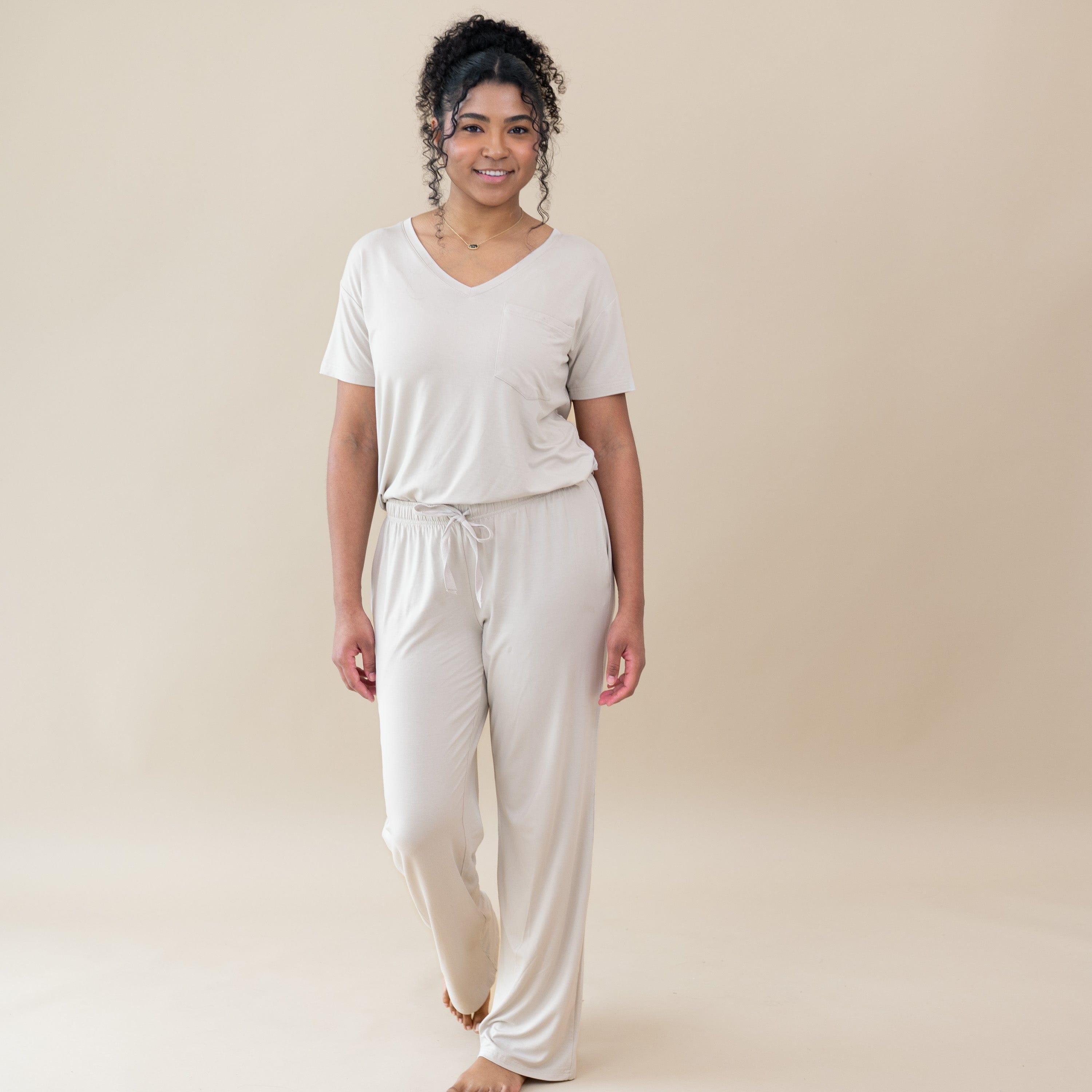 Woman modeling Women’s Relaxed Fit V-Neck in Oat and lounge pant