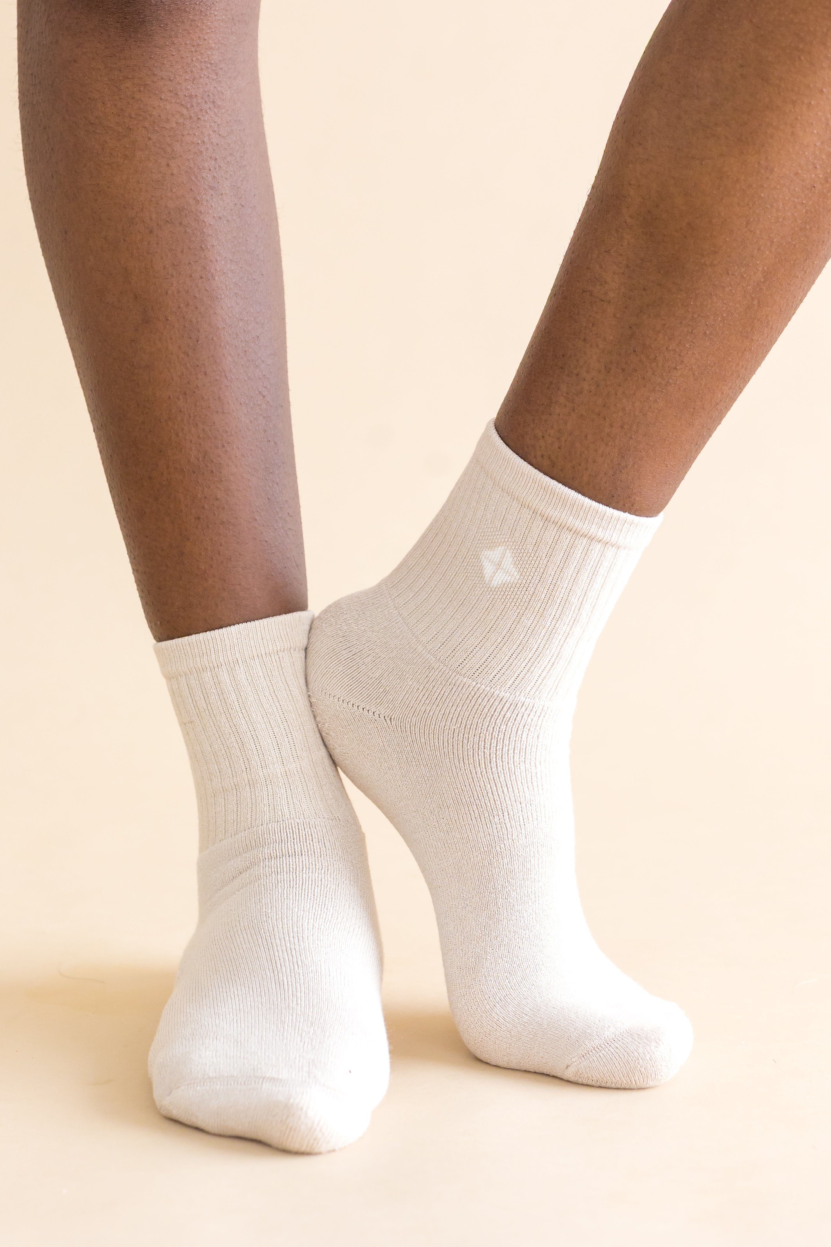 Adult Crew Socks in Oat shown on a models feet