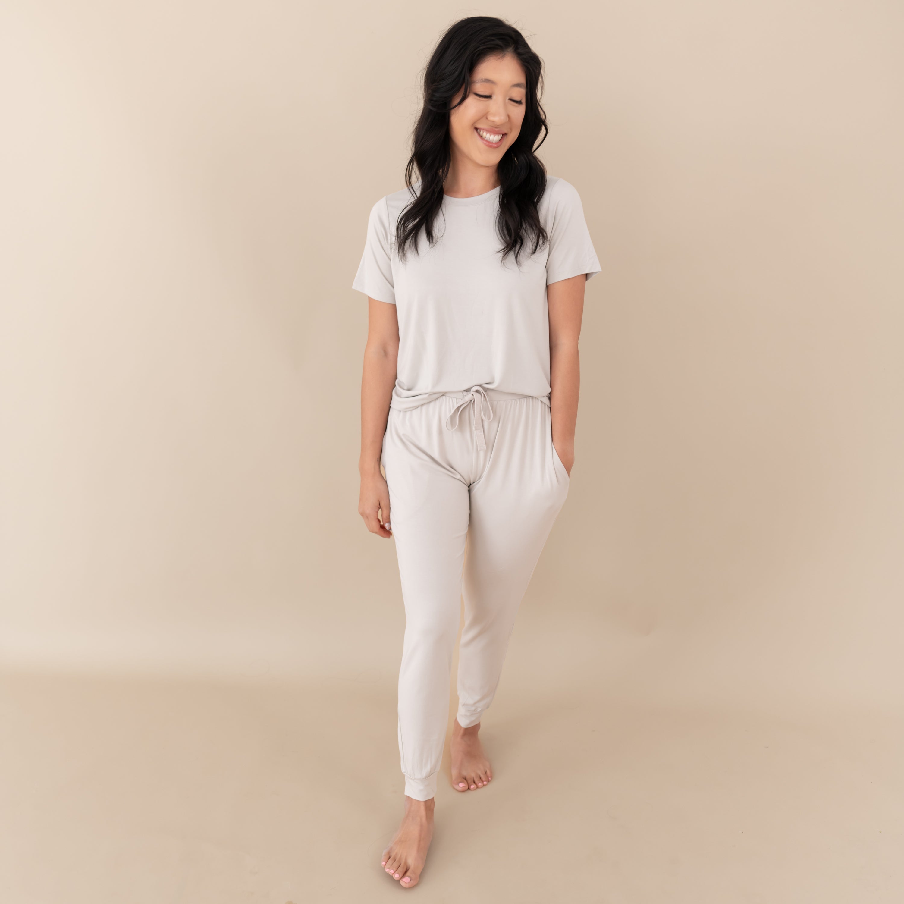 Woman modeling Women's Jogger Pants in Oat with hand in pocket