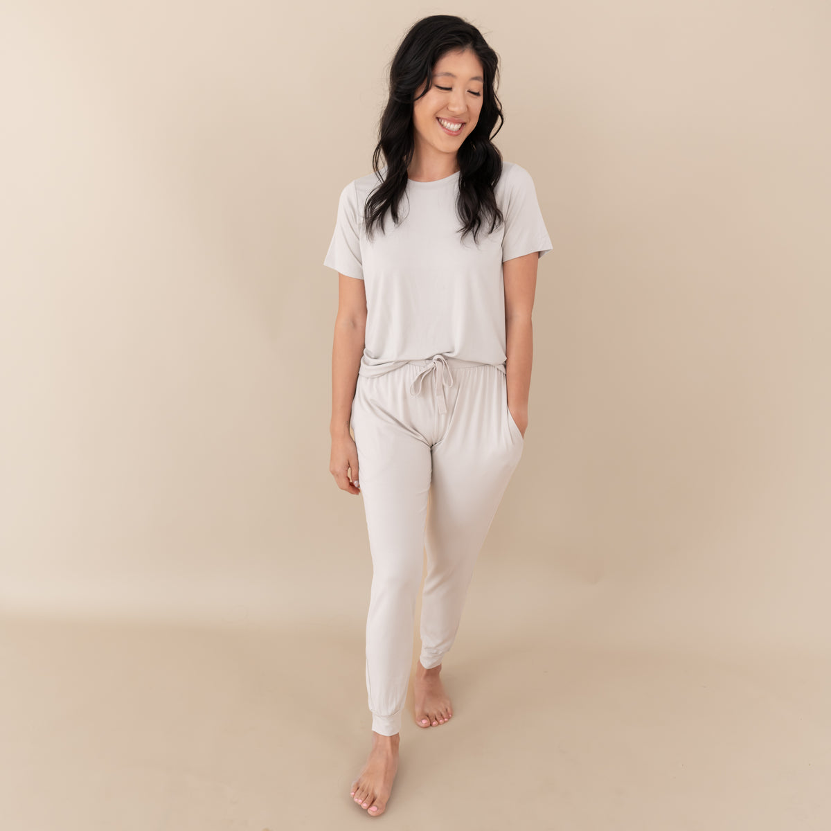 Woman modeling Women's Jogger Pants in Oat with hand in pocket