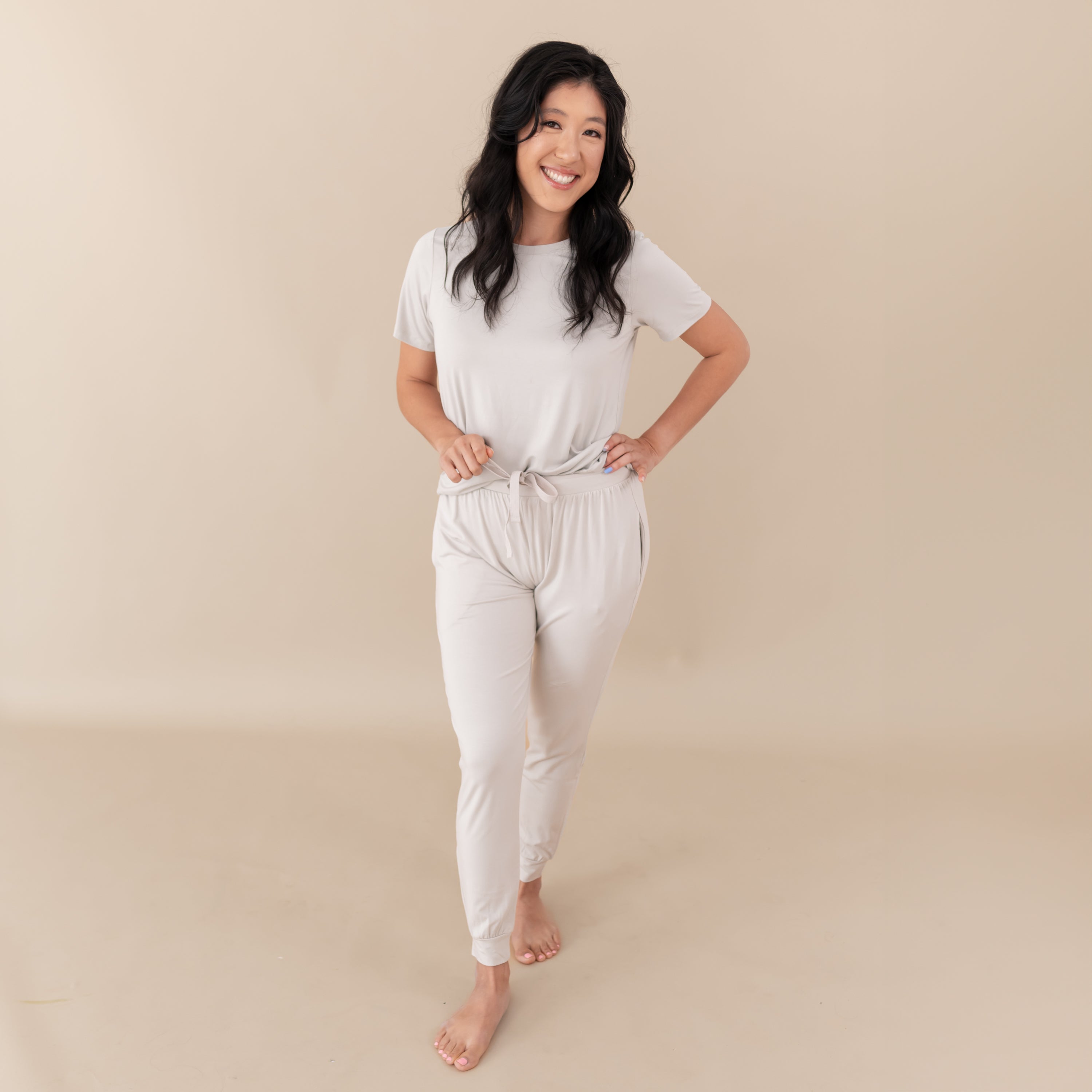 Woman modeling Women's Jogger Pants in Oat with hand on hip