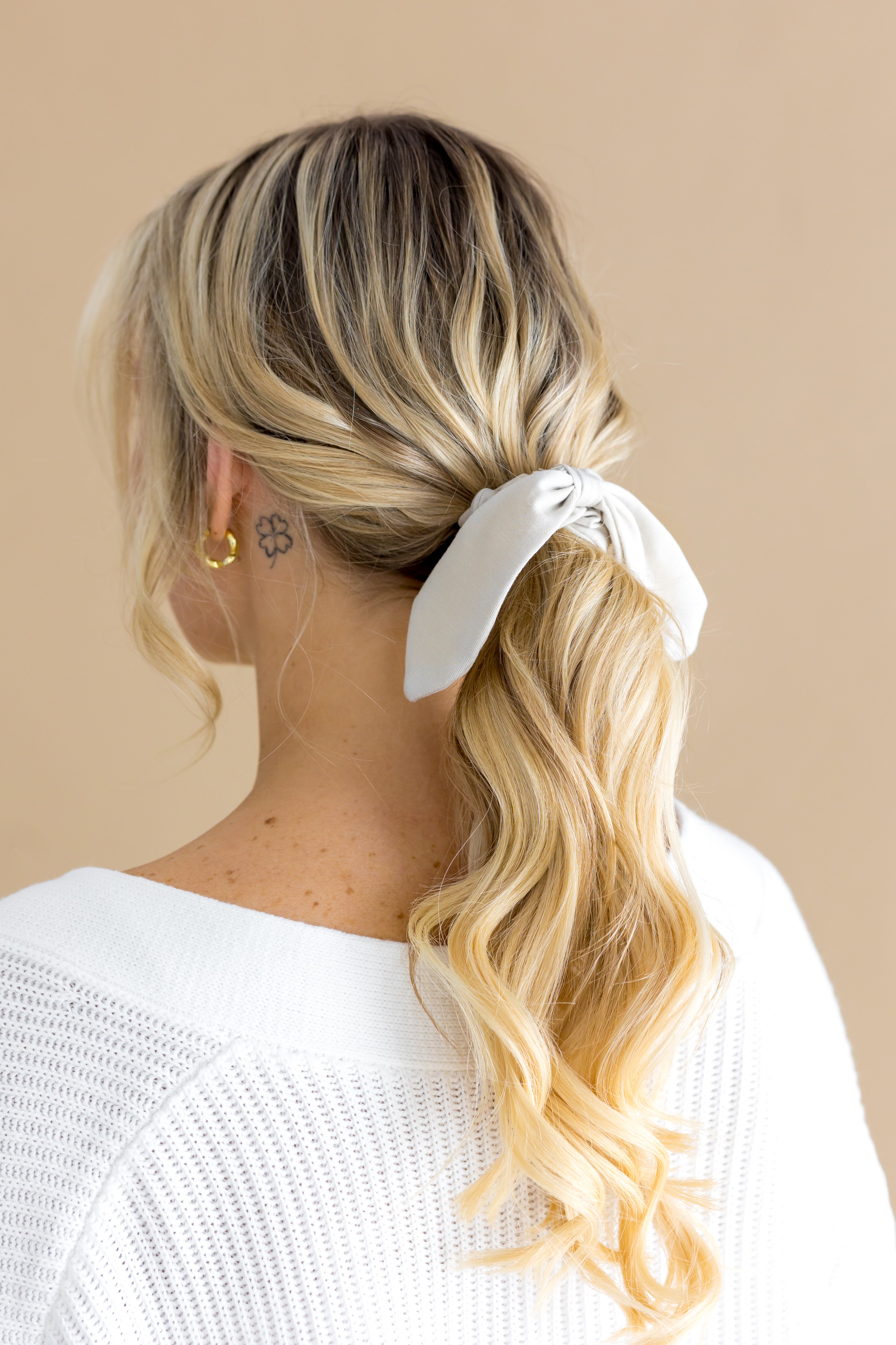 Scrunchie in Oat shown in a female models hair