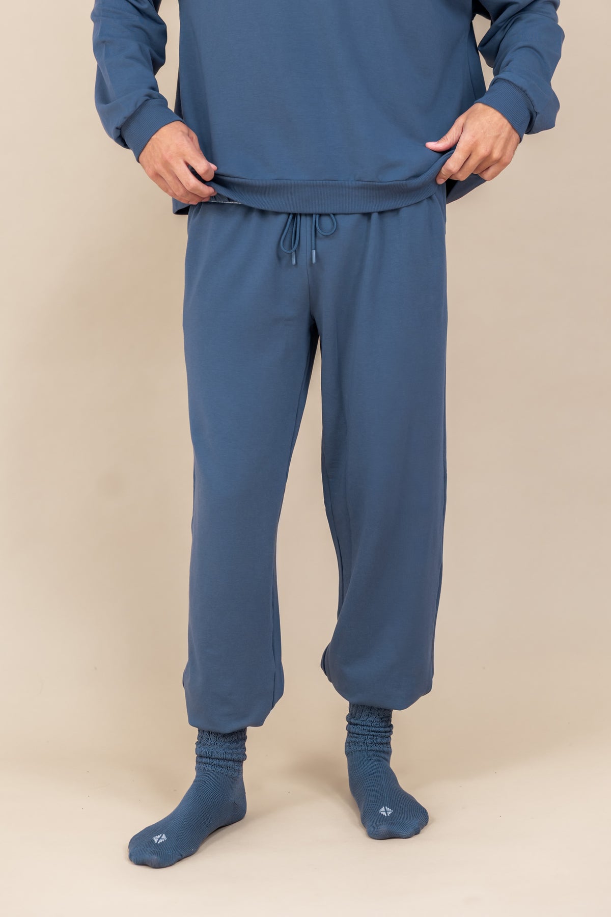 Modal wearing Adult Scrunch Socks in Oxford color over oxford color jogger set on a beige background