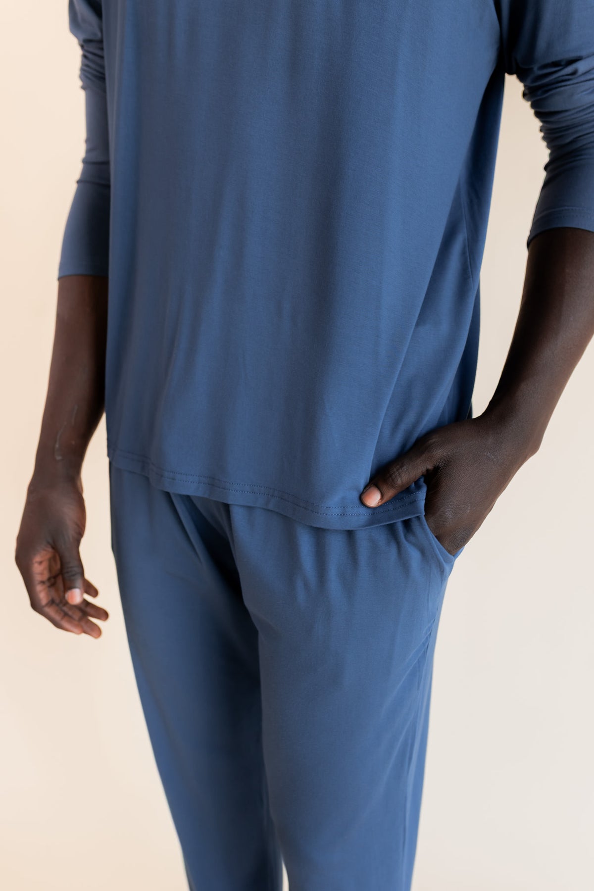 Close up of Men's Jogger Set pockets in Oxford on a beige background