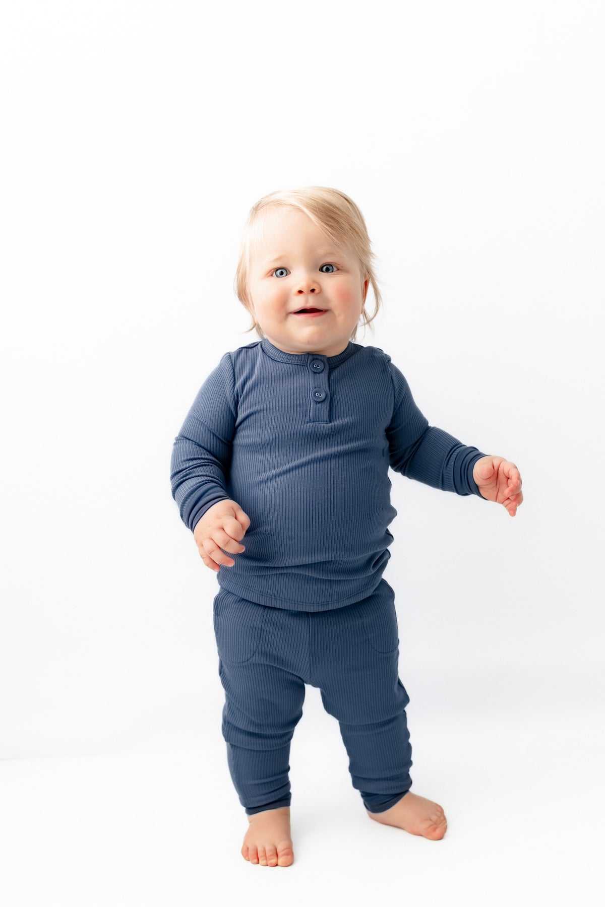 Baby wearing Ribbed Infant Henley Set in Oxford on a white background