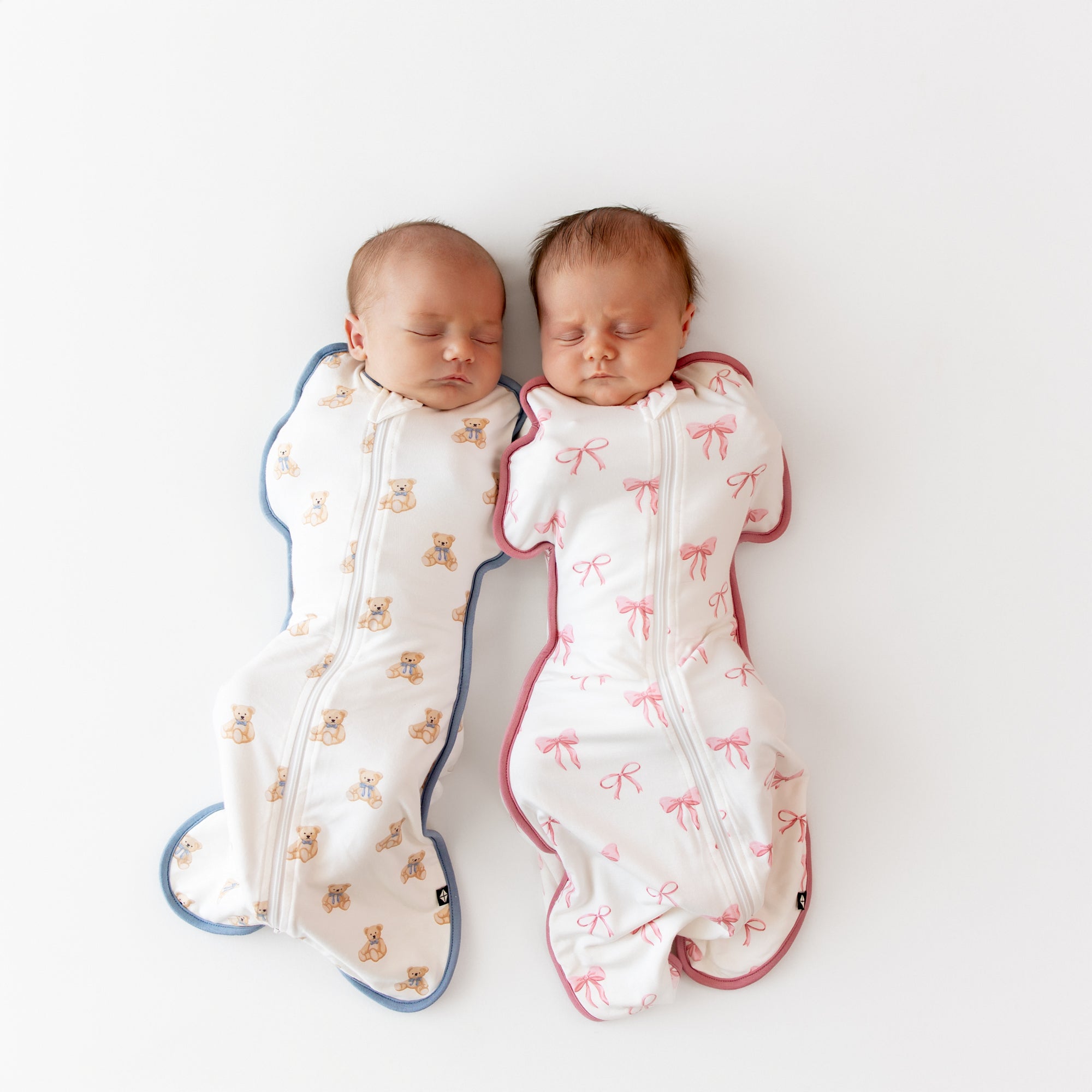 Two babies sleeping in Swaddle Bags in Teddy Bear and Bow 0.5