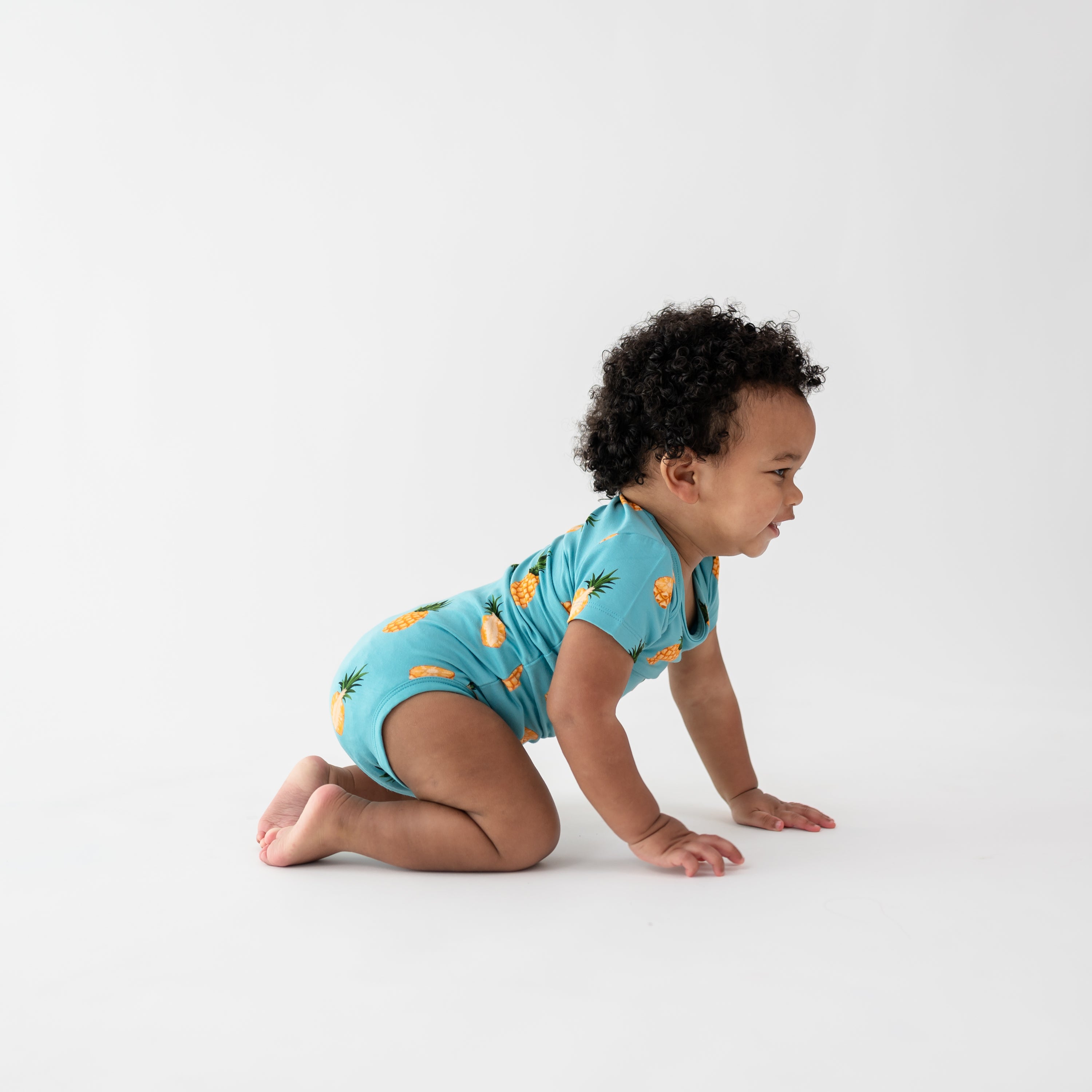 Baby crawling wearing Bodysuit in Pineapple