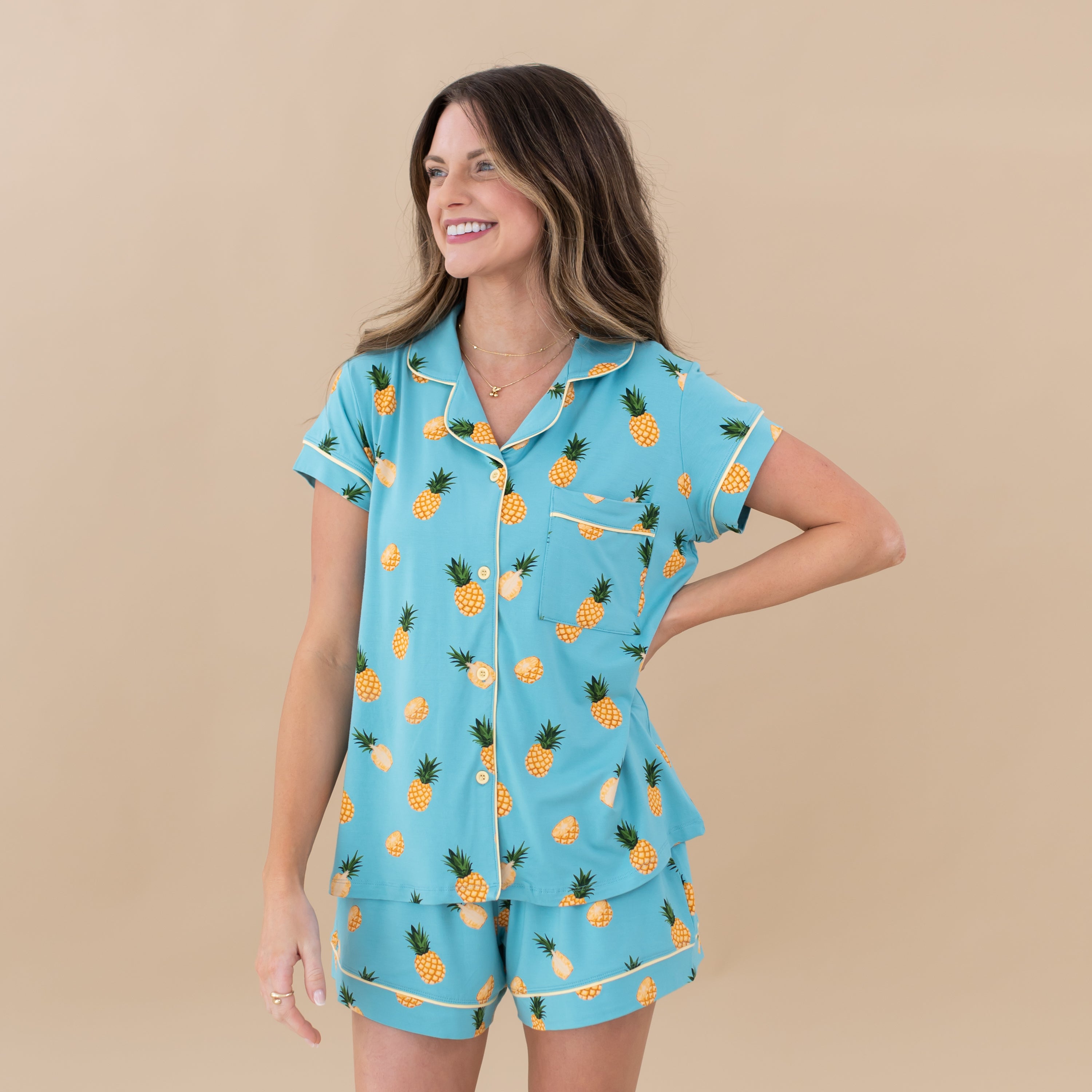 Woman modeling Women’s Short Sleeve Pajama Set in Pineapple with hand on hip