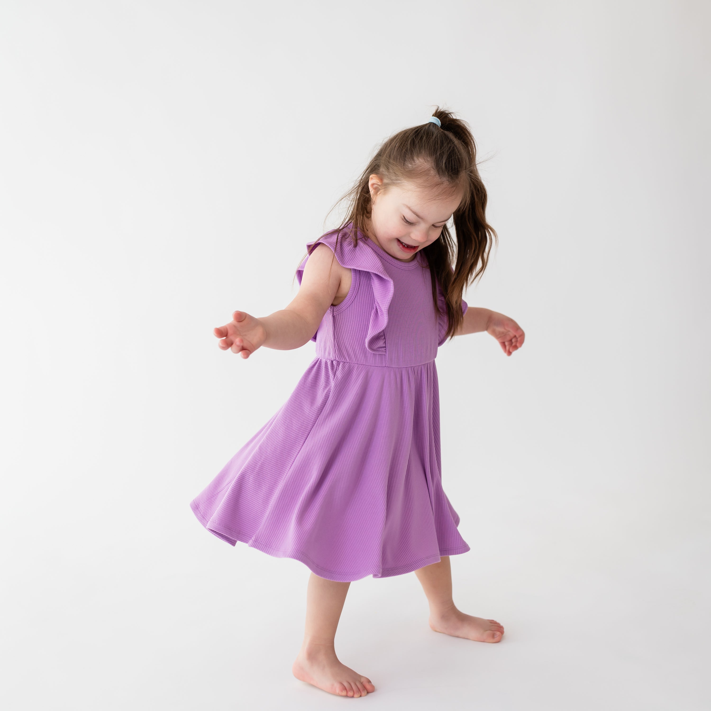 Girl wearing Ribbed Peplum Dress Set with Bloomers in Poi