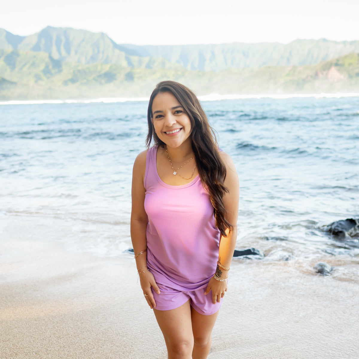 Woman modeling Women’s Tank Set in Poi on beach