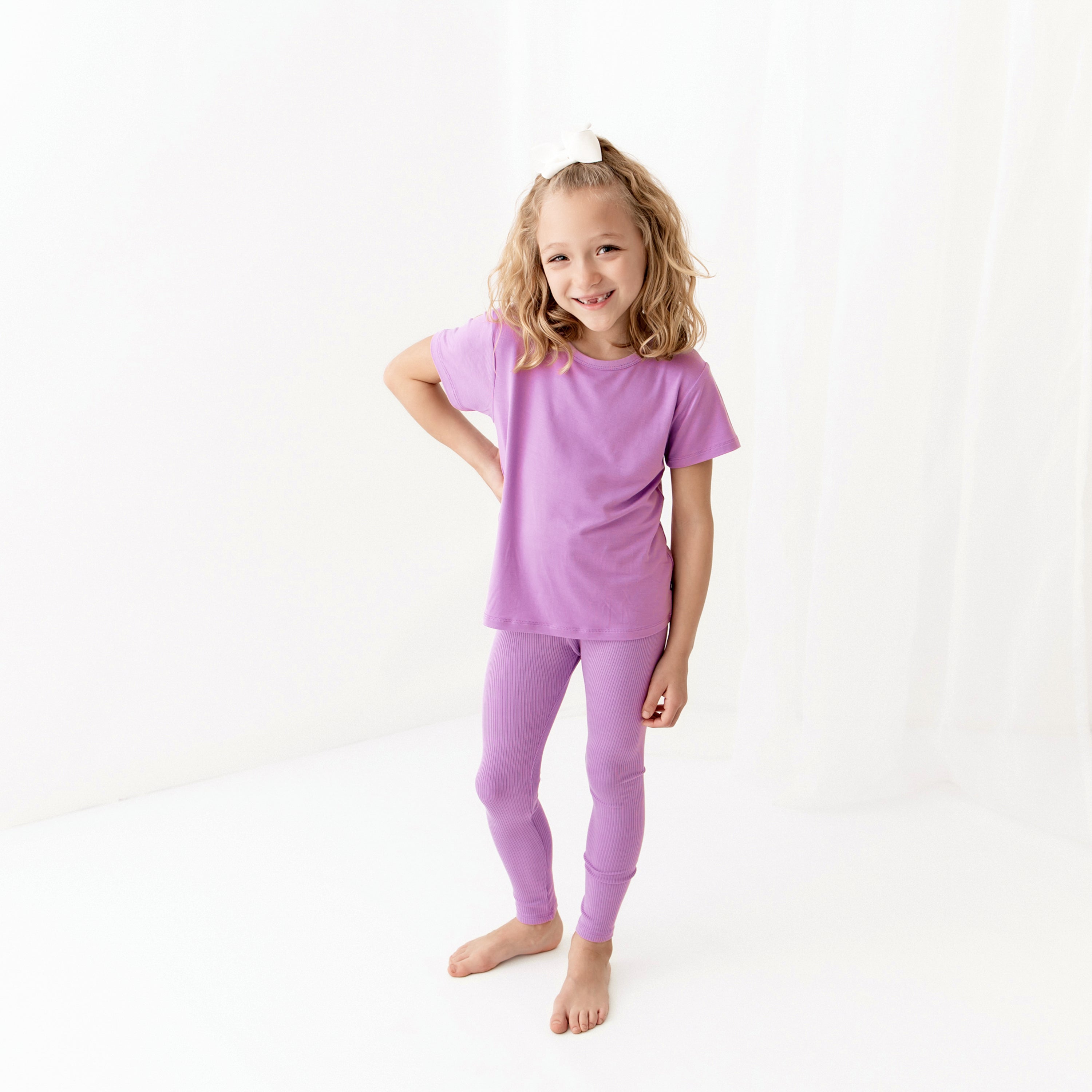 Girl wearing Ribbed Leggings in Poi with matching shirt