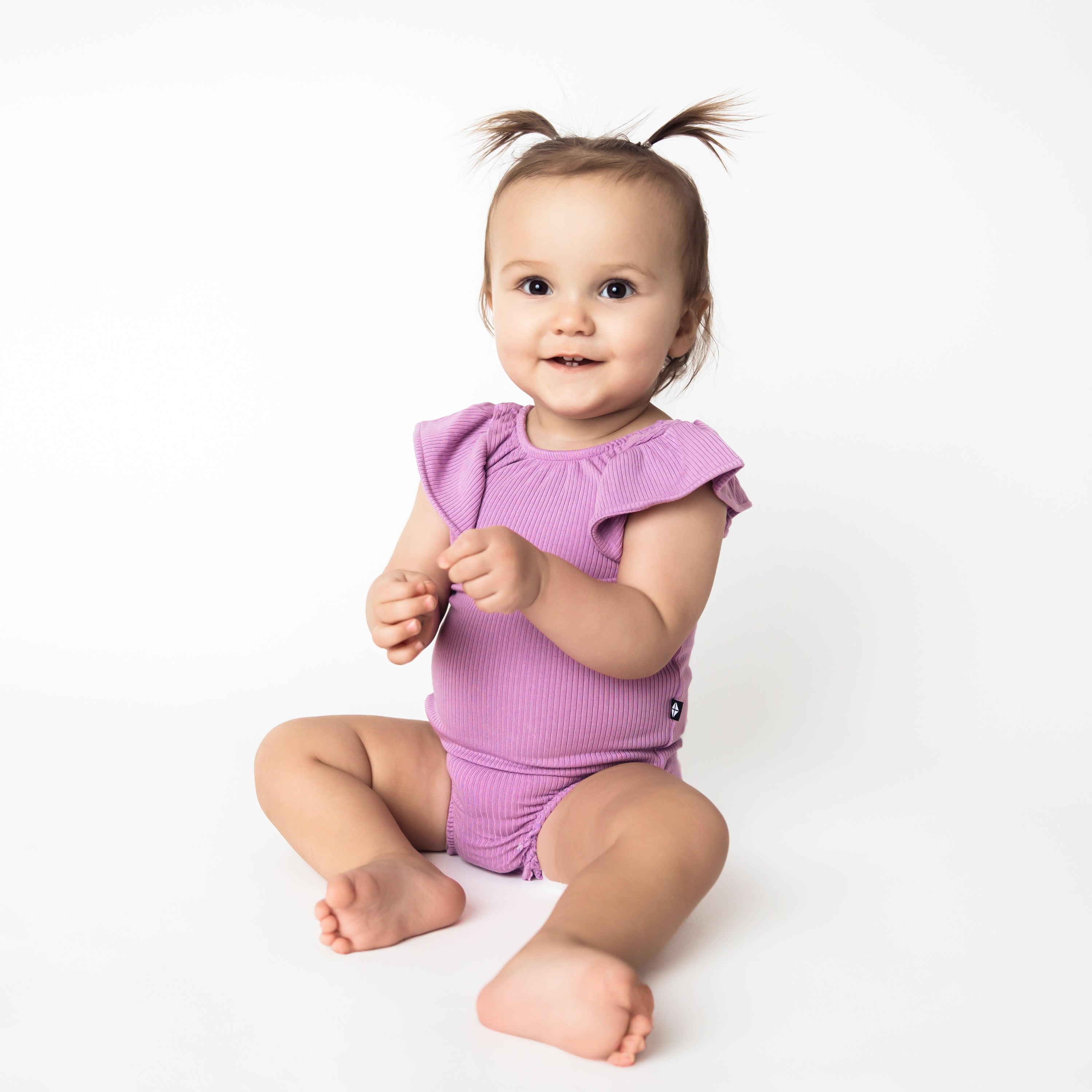 Baby wearing Ribbed Sleeveless Ruffle Leotard in Poi Purple