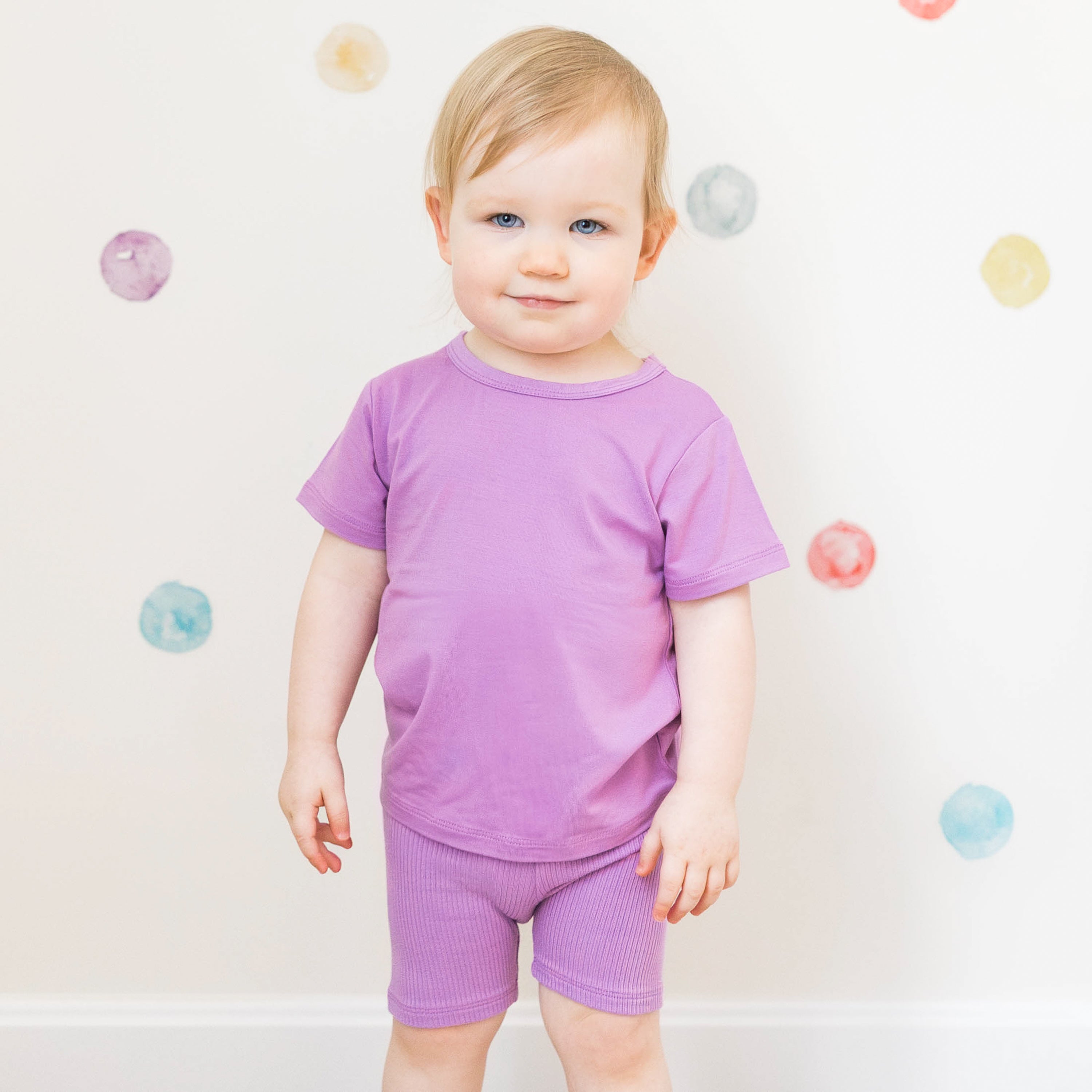 Child wearing Ribbed Toddler Biker Shorts in Poi Purple with matching shirt